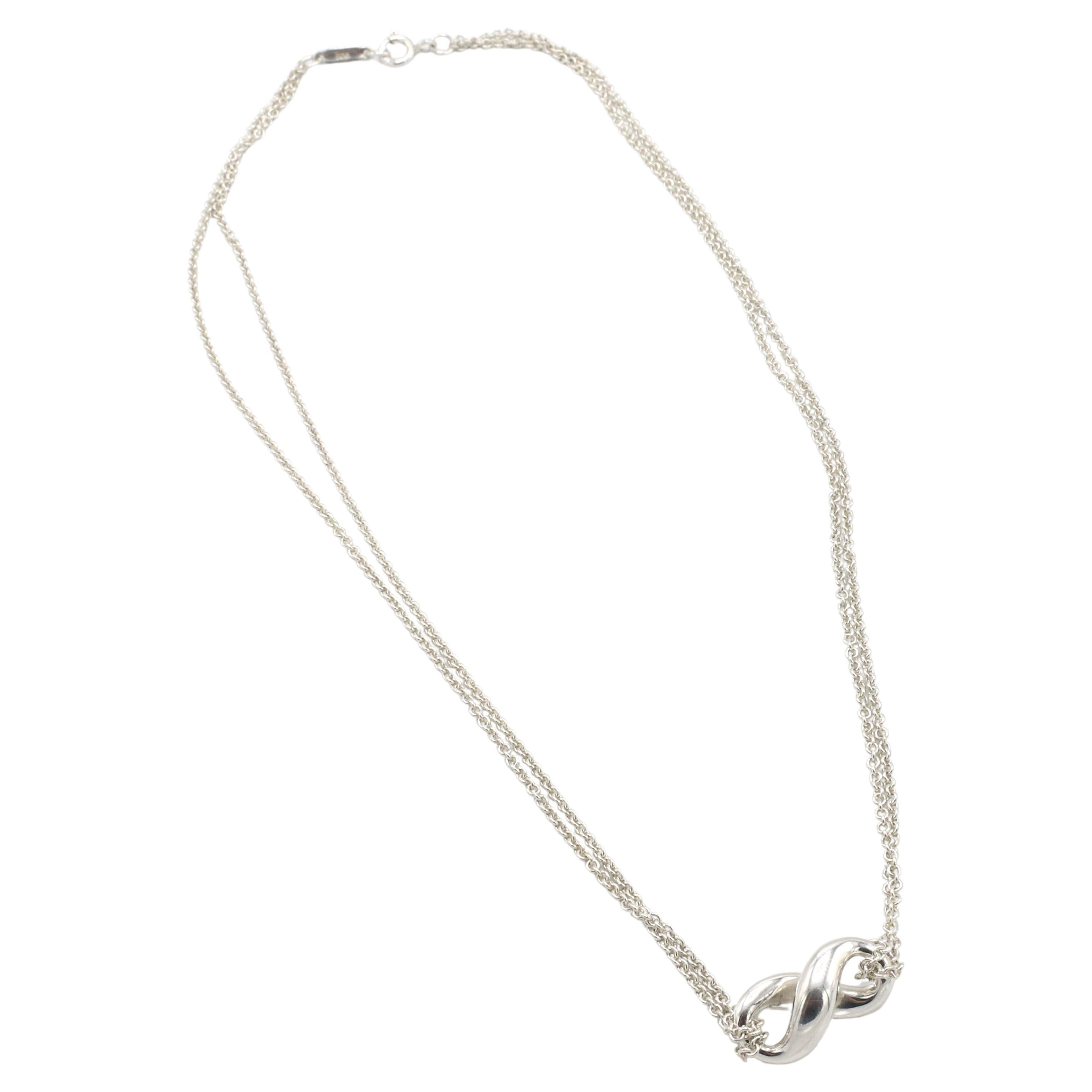 Tiffany & Co. Sterling Silver Infinity Double Chain Pendant Necklace
Metal: Sterling silver 925
Weight: 7.44 grams
Length: 16 inches
Pendant: 20mm
Signed: ©Tiffany & Co. 925 