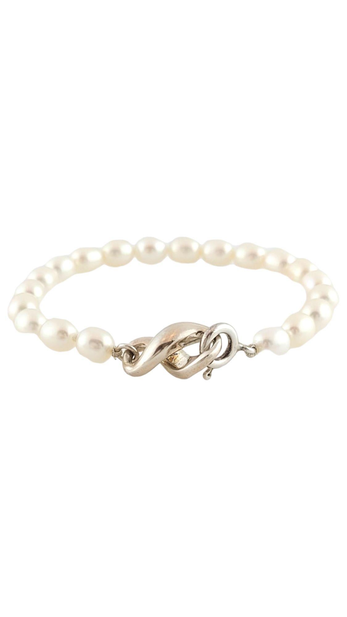 Tiffany & Co Sterling Silver Infinity Figure 8 Pearl Bracelet

This gorgeous sterling silver infinity figure 8 bracelet features 20 beautiful pearls.

Pearls approximately 6.4mm each

Length: 6.25