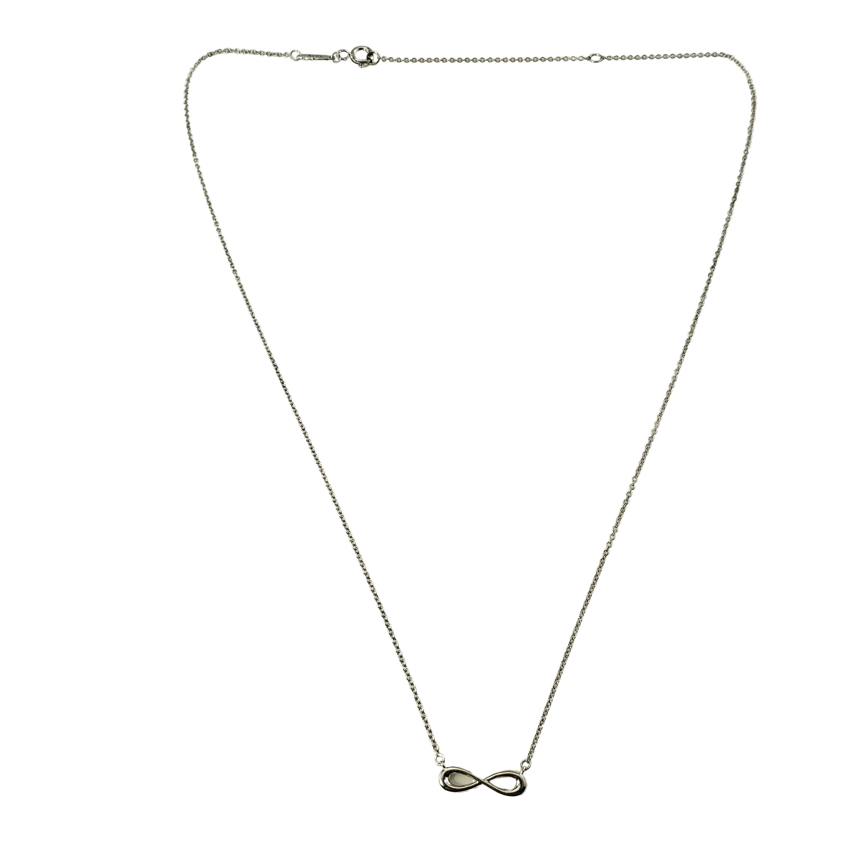 Vintage Tiffany & Co. Sterling Silver Infinity Necklace-

This elegant necklace by Tiffany & Co. features the infinity symbol crafted in beautifully detailed sterling silver.

Size: 16
