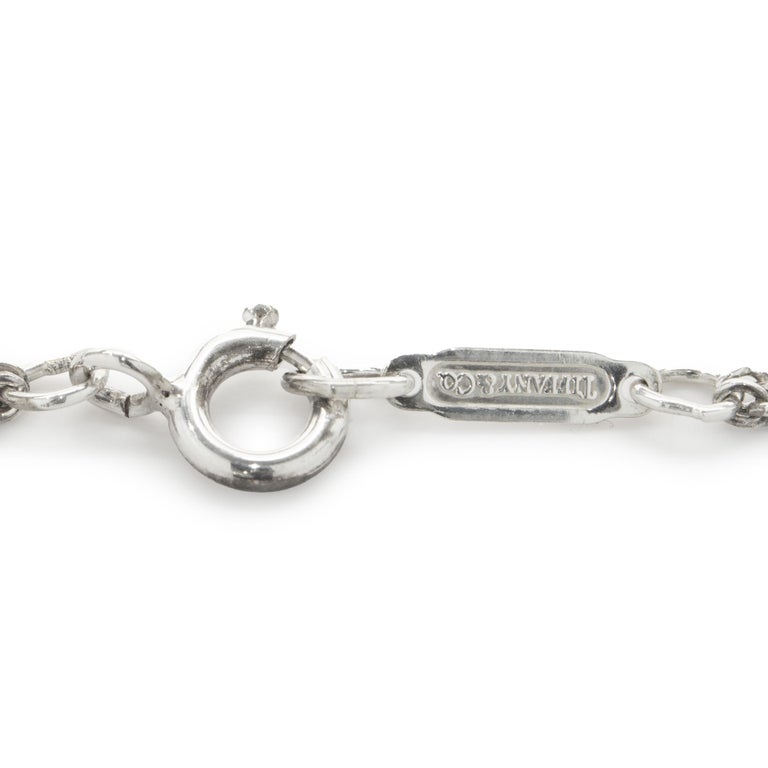Designer: Tiffany & Co. 
Material: sterling silver
Dimensions: necklace measures 18-inches in length
Weight: 7.30 grams