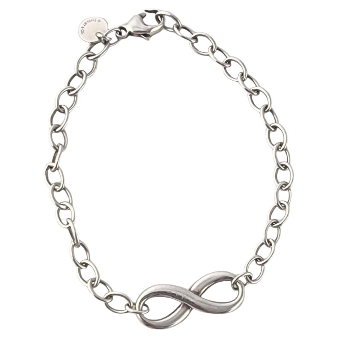 Tiffany 
Co Plata de Ley Pulsera de eslabones con el signo del infinito #23993 en venta