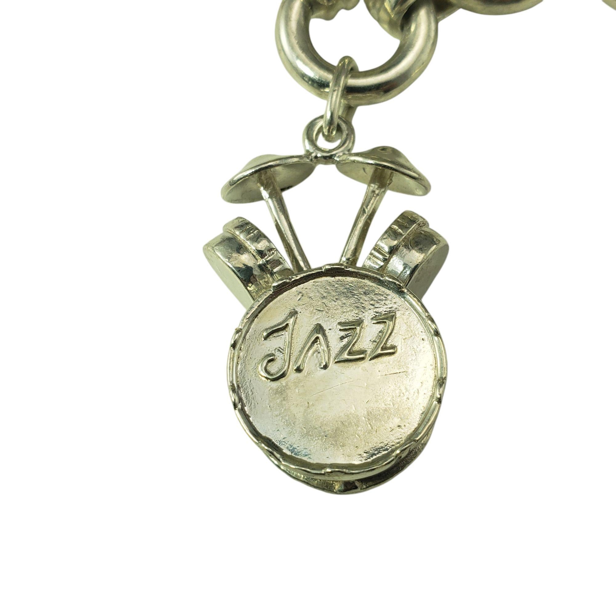 Tiffany & Co. Sterling Silver Jazz Instrument Charm Bracelet-

Celebrate a love for music with this rare whimsical and collectible charm bracelet by Tiffany & Co. Crafted in sterling silver, it features finely detailed jazz instrument charms- a