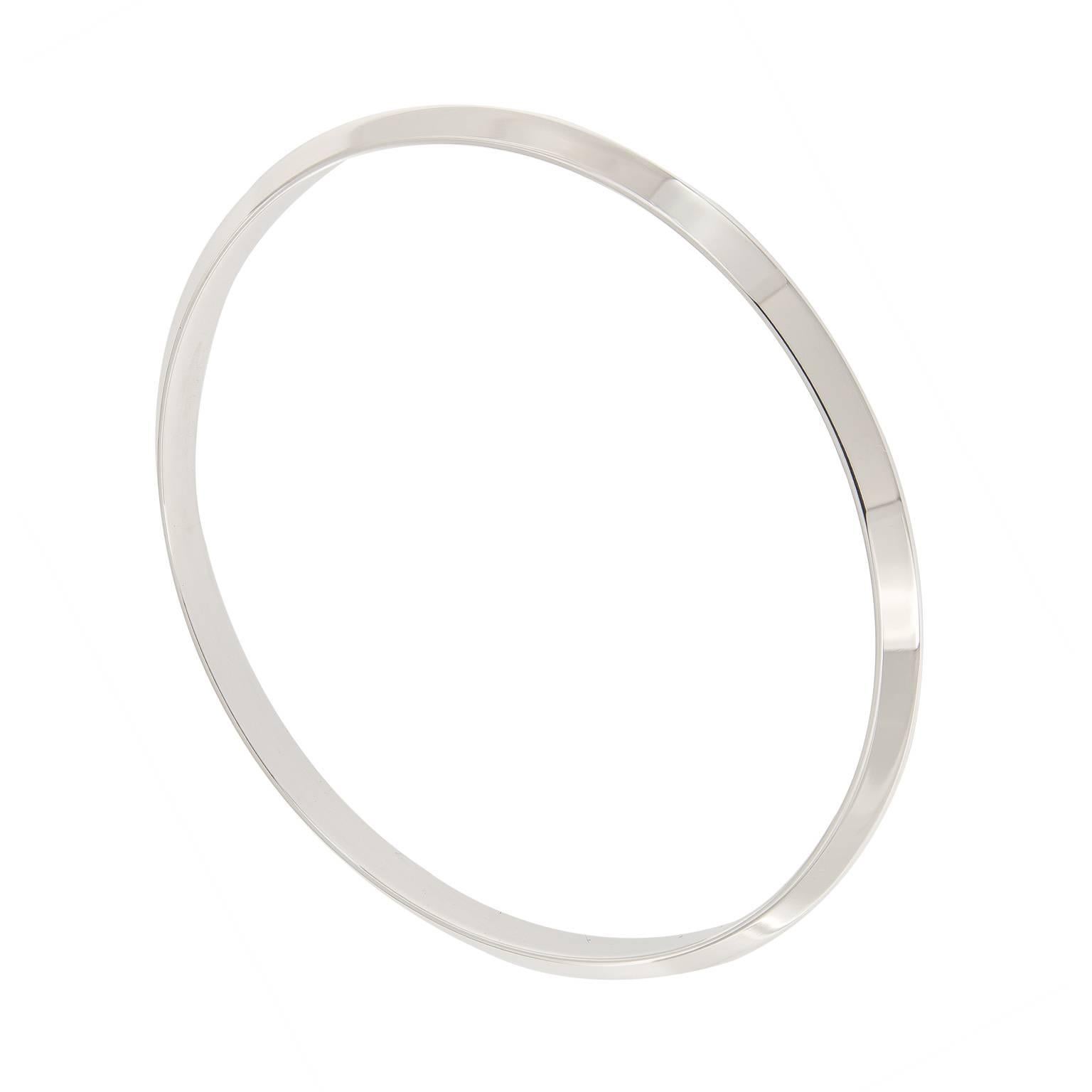 Signature style bangle bracelets from Tiffany. This bracelet is simple and classic on its own or great for stacking. We have only 2 left & available. 

Inner Diameter 2.5 in. (6.35 cm). Weighs 16.7 grams.

Marked Tiffany & Co.