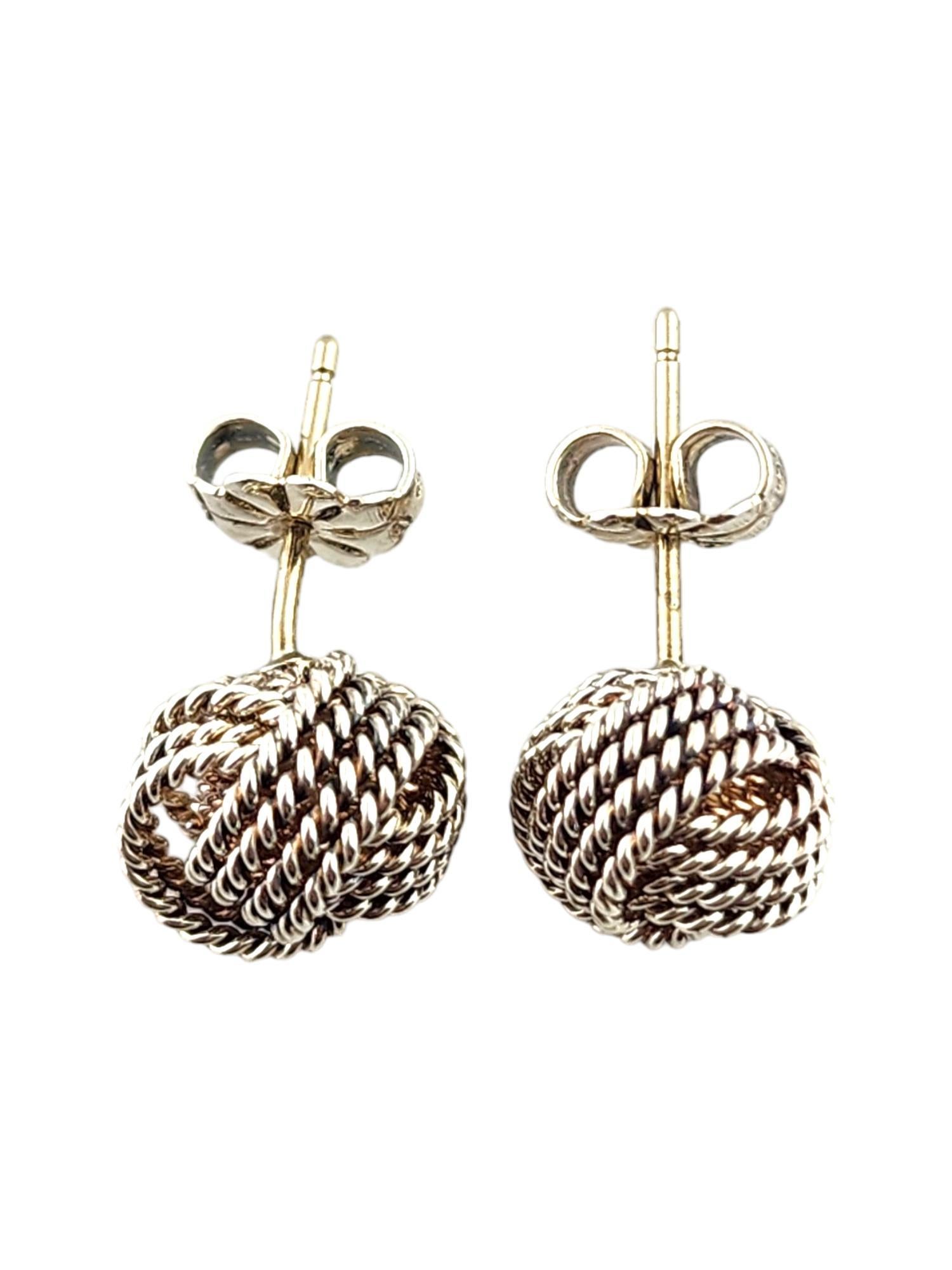 Tiffany & Co Sterling Silver Knot Earrings

This beautiful set of Tiffany & Co earrings were meticulously crafted from sterling silver in a gorgeous knot shape!

Size: 9.1mm X 9.1mm X 7.5mm

Weight: 1.8 dwt/ 2.9 g

Hallmark: T&Co 925

Very good