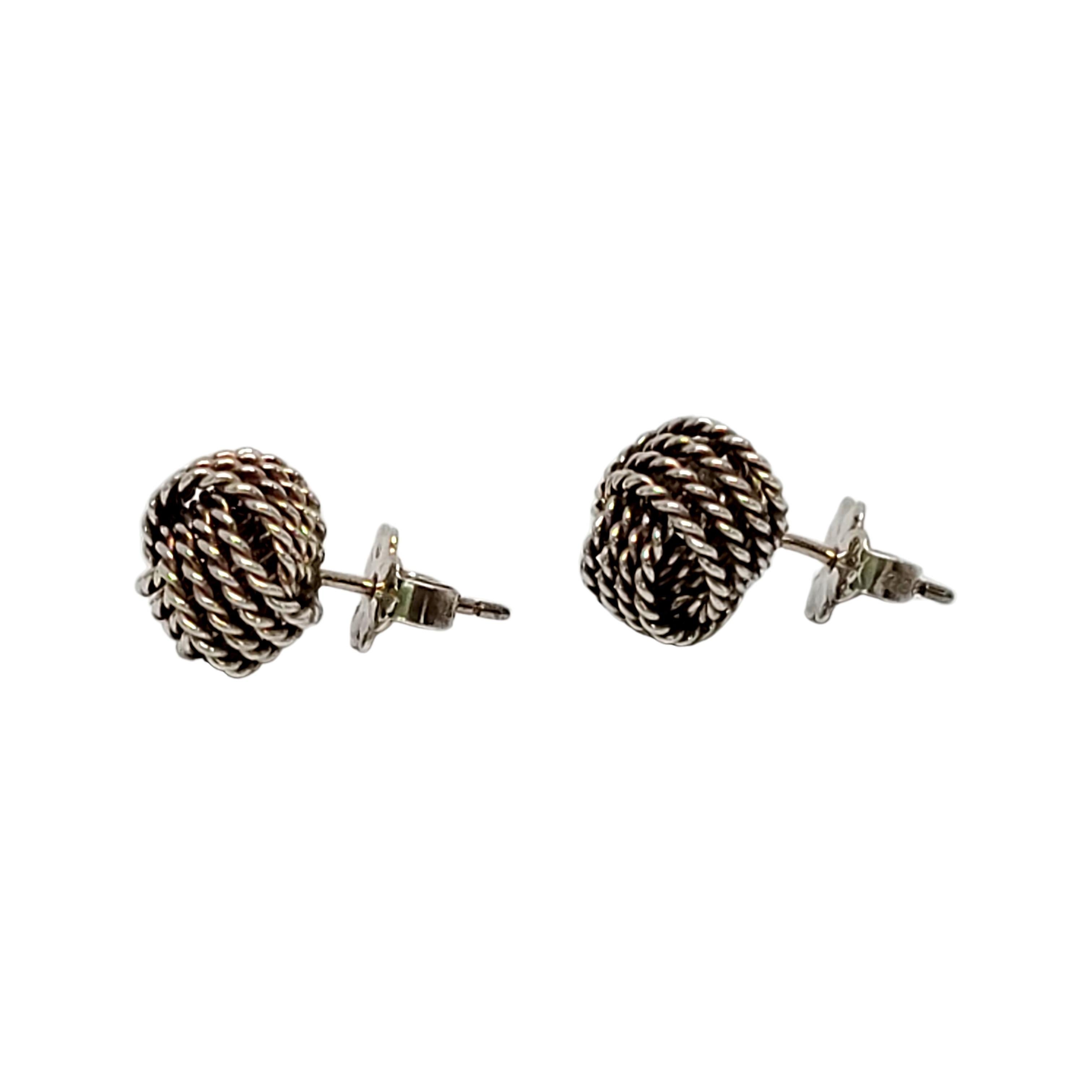 Tiffany & Co sterling silver twist knot stud earrings.

Authentic Tiffany earrings with a modern and timeless mesh knot design.  Tiffany box and pouch not included.

Measures approx 9mm in diameter.

Weighs approx 2.8g, 1.8dwt

Very nice condition