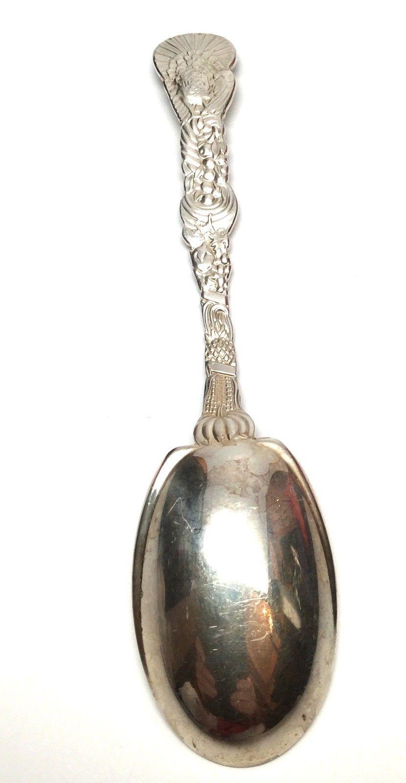 Lovely Tiffany & Co. sterling silver cranberry serving spoon. Its theme is Thanksgiving and it is beautifully decorated, front and back, with a turkey, cornucopia, pumpkins, and corn. 
Measurement: Length: 7 3/16 inches. Width of spoon: 1 7/8