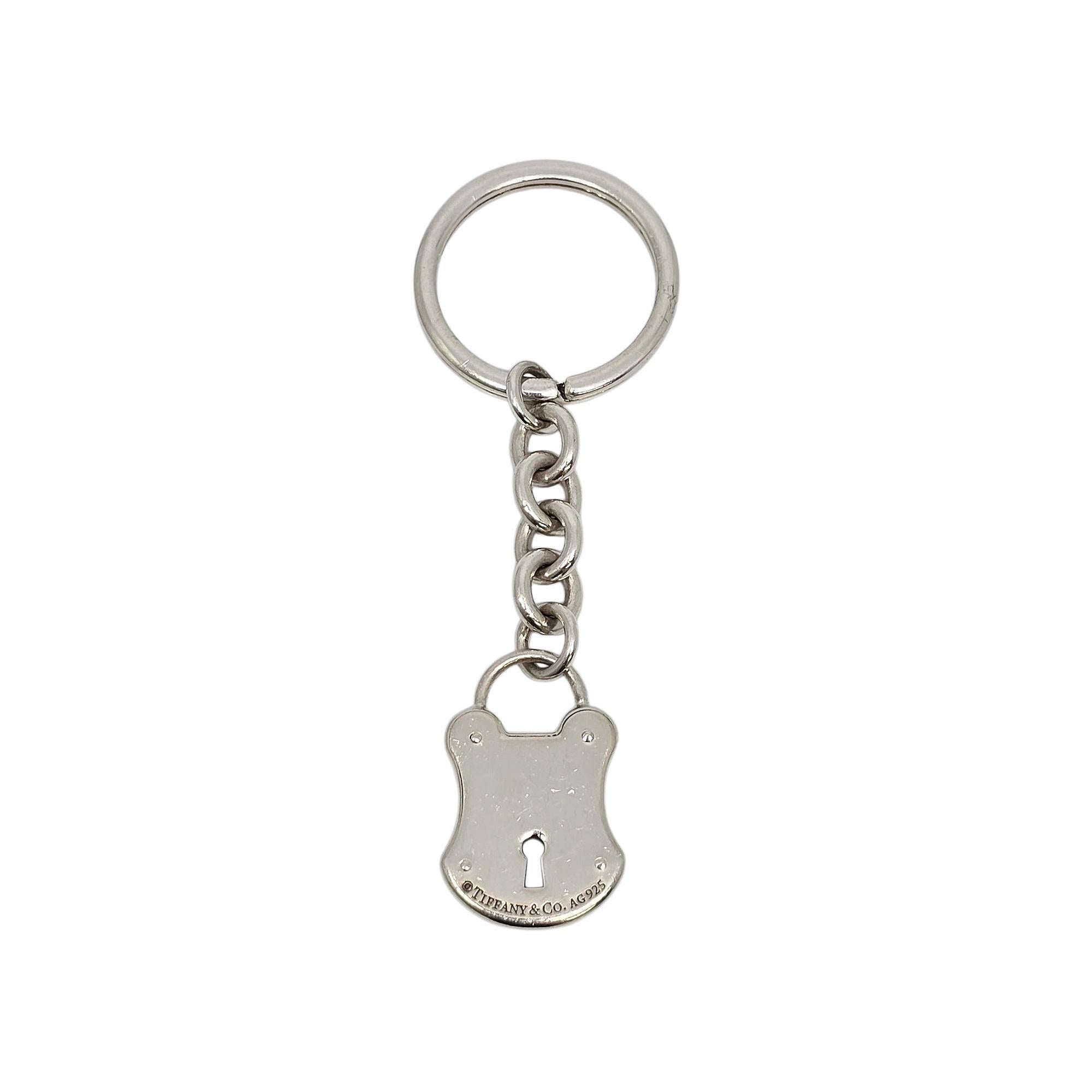 Sterling silver lock keychain/key ring by Tiffany & Co.

This Tiffany & Co key ring features their iconic lock design. Tiffany & Co box and pouch are not included.

Measures approx 3 1/8