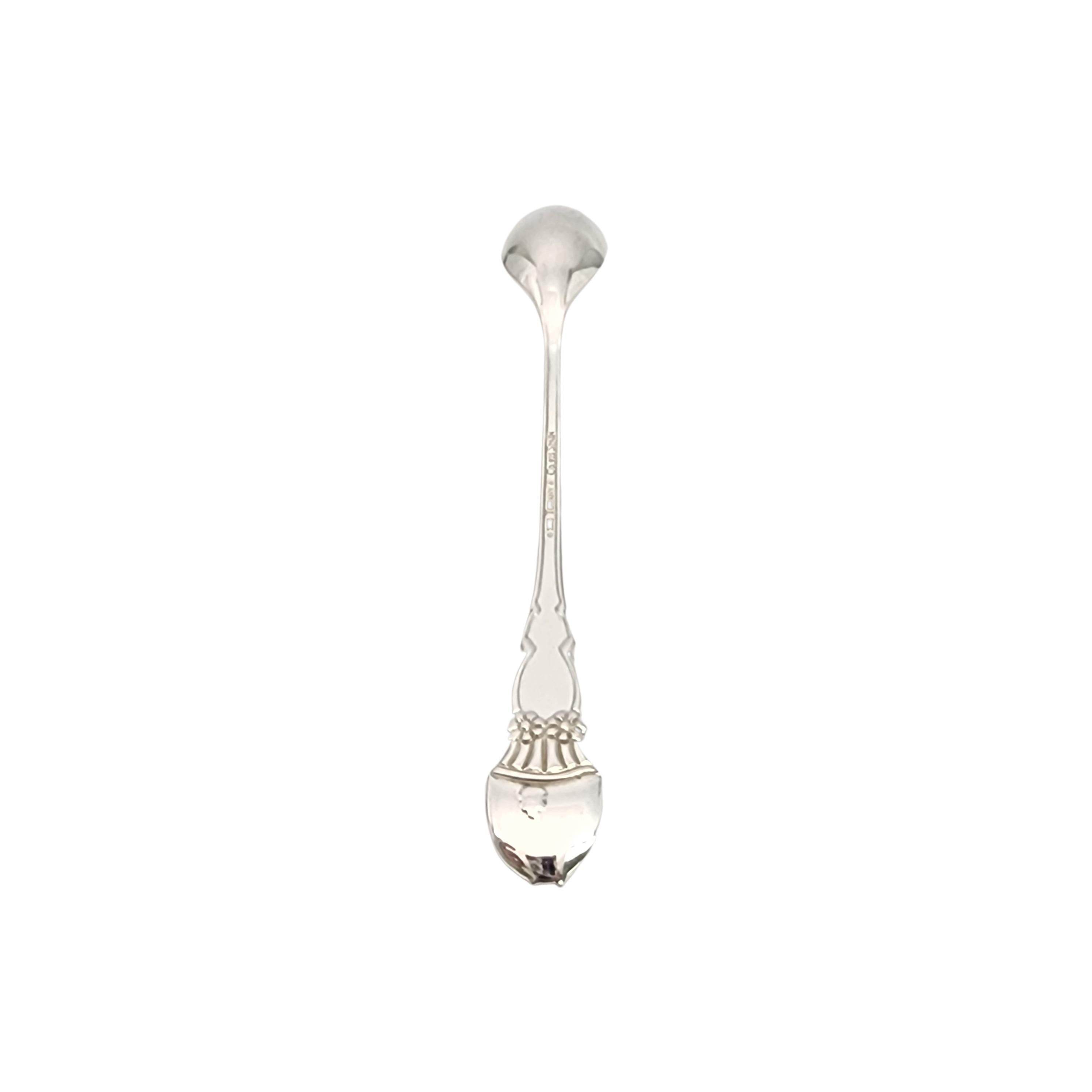 Tiffany & Co sterling silver Meadows baby feeding spoon with pouch.

Meadows is a simple and classic design featuring a a bunny rabbit and flowers with a bow on the front of the handle and a small bunny tail on top of the back of the handle. No