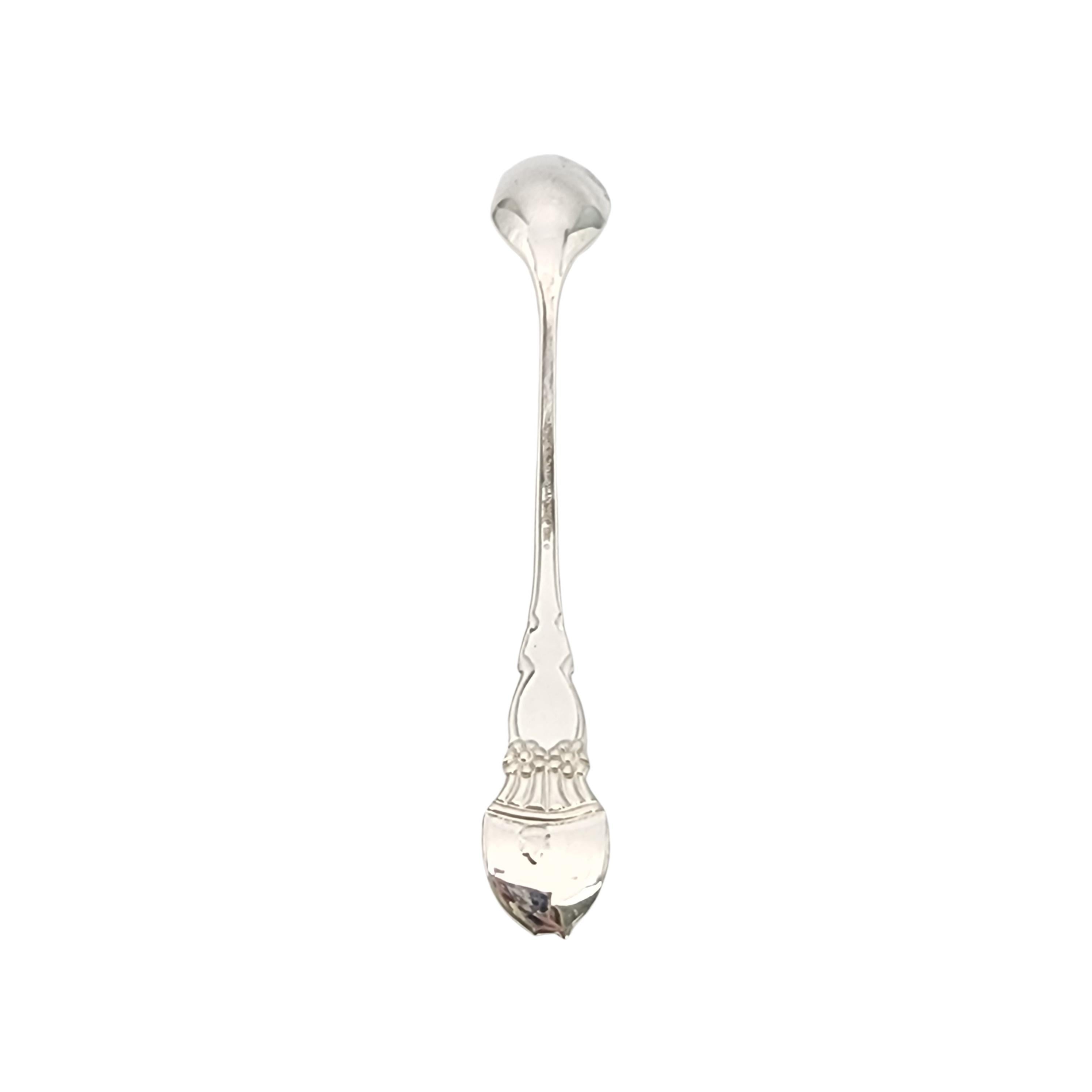 Tiffany & Co sterling silver Meadows baby feeding spoon with pouch.

Meadows is a simple and classic design featuring a a bunny rabbit and flowers with a bow on the front of the handle and a small bunny tail on top of the back of the handle. No