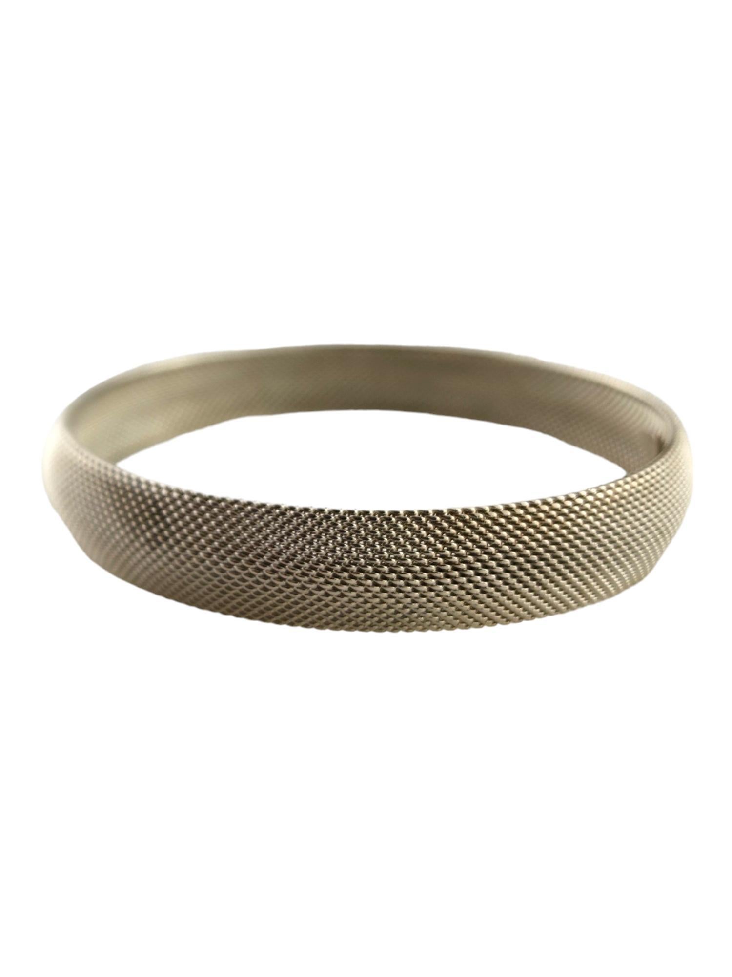 Tiffany & Co Sterling Silver Firm Mesh Bangle Bracelet

This beautiful bangle bracelet by Tiffany & Co was crafted from sterling silver in a beautiful mesh pattern! This is the firmer version of the bracelet

Size: 7.75