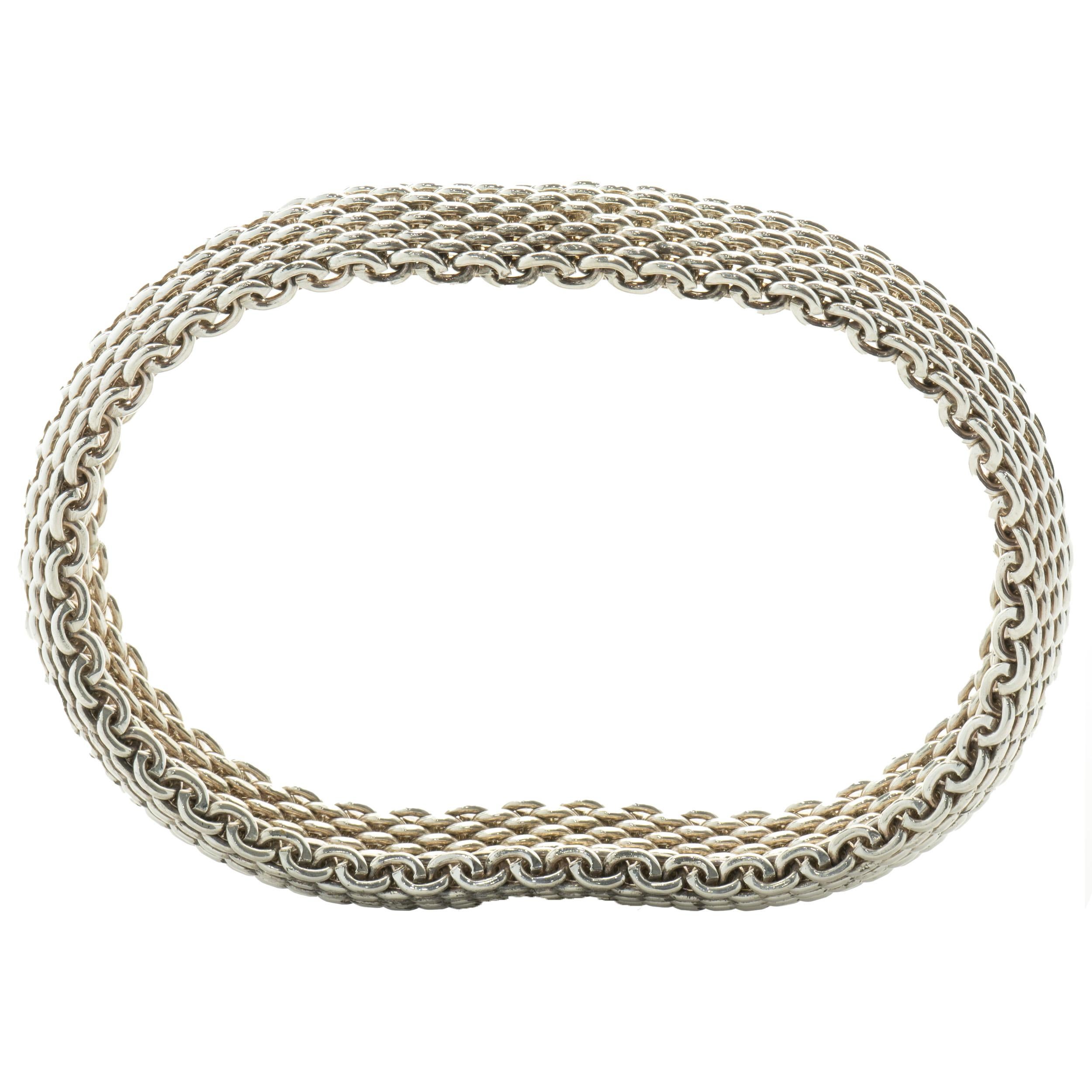 Designer: Tiffany & Co. 
Material: sterling silver
Dimensions: bracelet measures 15mm wide
Weight: 57 grams
Size: 7.5-inches

No box or papers included