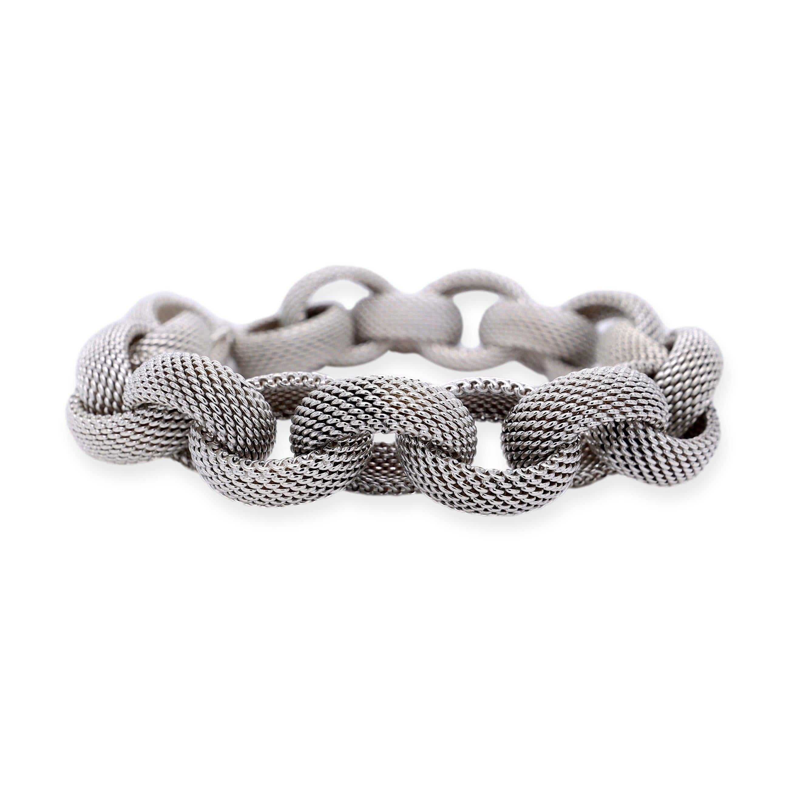 Tiffany & Co. Link Somerset Toggle Bracelet is an exquisite piece of jewelry crafted with the finest quality sterling silver. The bracelet features interlocking woven mesh oval links, beautifully designed to create an elegant and sophisticated look.