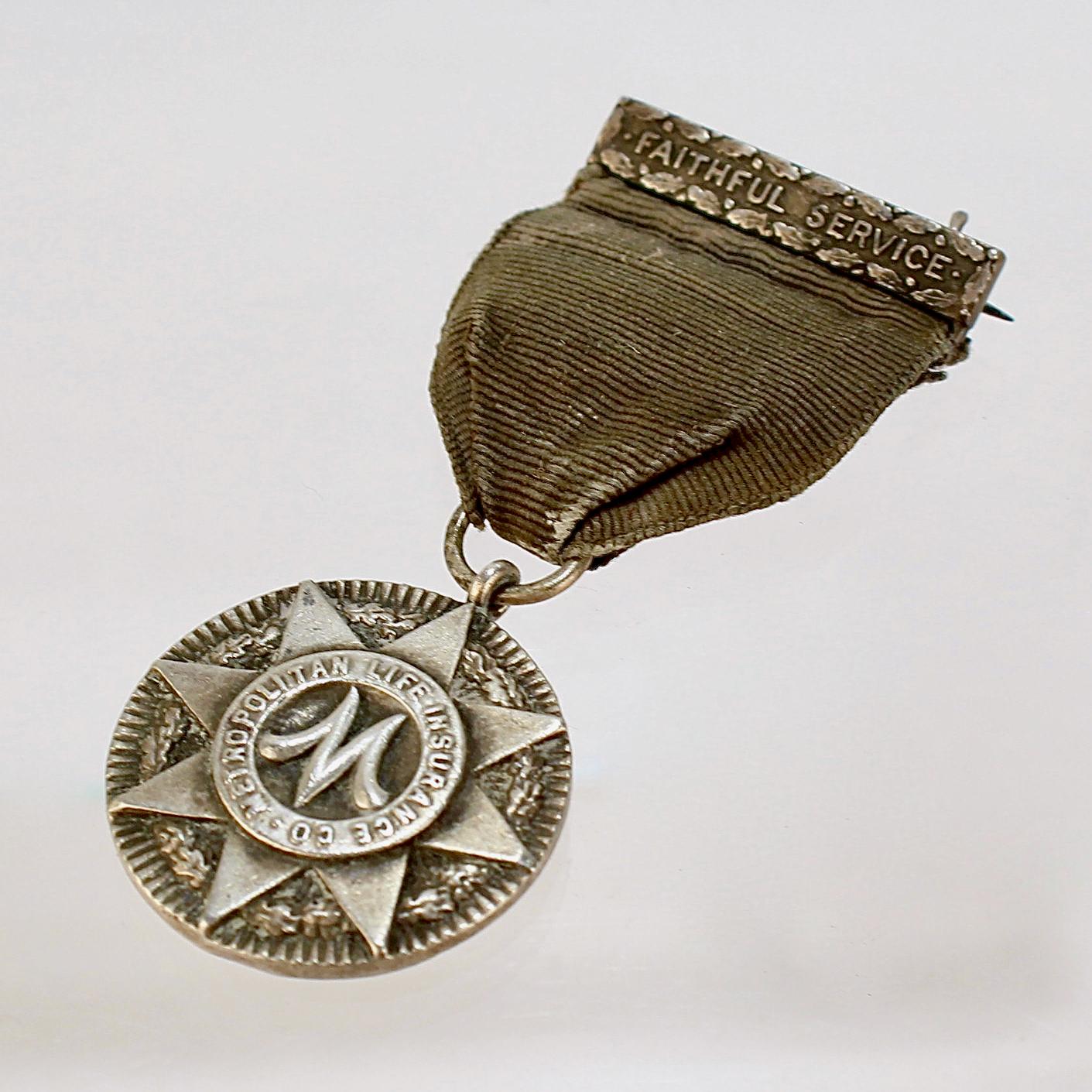 A fine sterling silver service medal for the Metropolitan Life Insurance Company.

Made by Tiffany & Co. 

Presented for faithful service. 

Simply a wonderful artifact from days gone by from Tiffany & Co.!

Date:
Early 20th Century

Overall