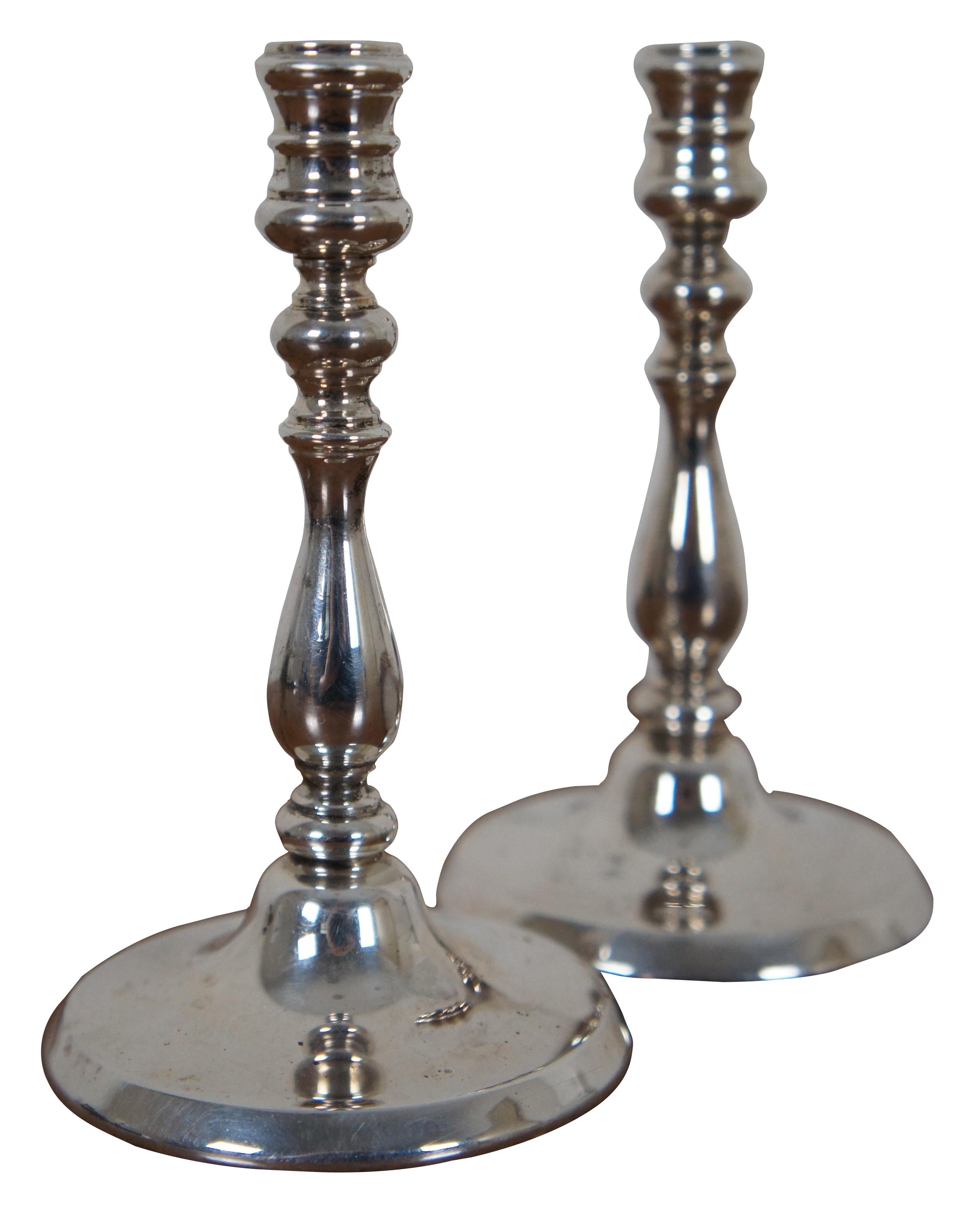 Vintage Tiffany & Co sterling silver miniature taper candlesticks, numbered 16.

Measures: 2.5” x 4.25” / combined weight - 251.5 g (diameter x height).