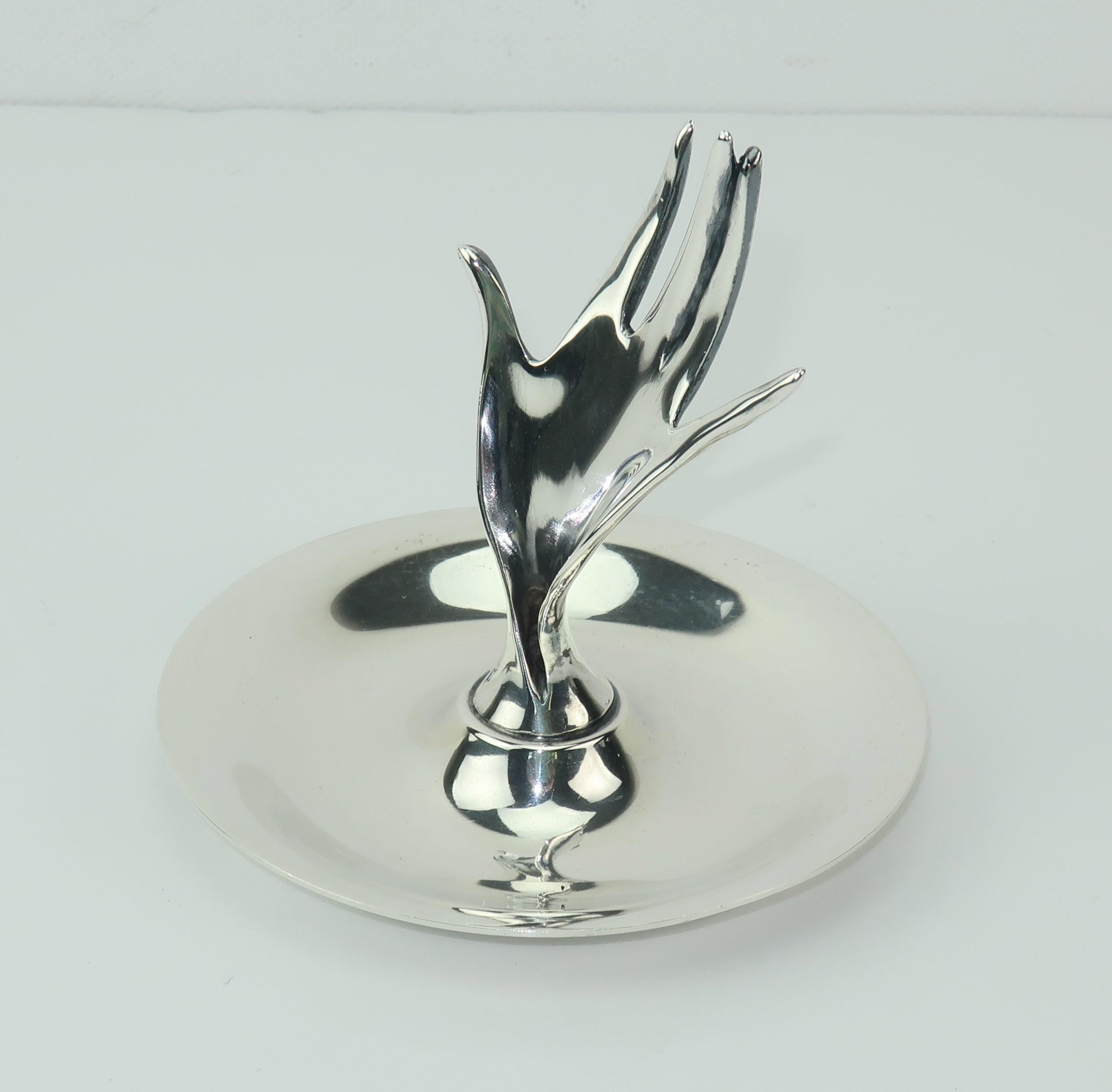 Tiffany & Company's 1950's sterling silver ring holder and pin dish depicting a stylized hand perfect for a vanity or bureau.  Beautifully detailed with the quality one would expect from Tiffany.  Measures 3.25