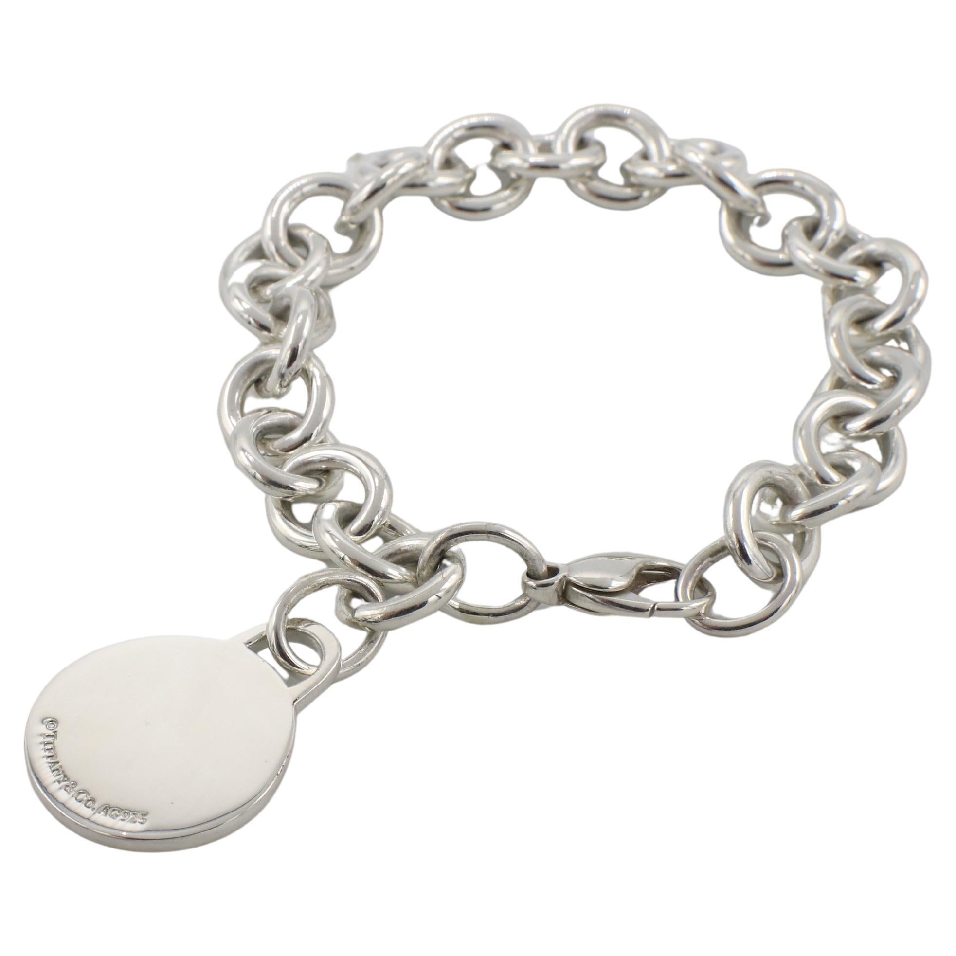 Tiffany & Co. Sterling Silver National Football League NFL Charm Link Bracelet 
Metal: 32.55 grams
Length: 7 inches
Signed: ©Tiffany & Co. Ag925 (NFL logo on charm)
Charm: 20mm
