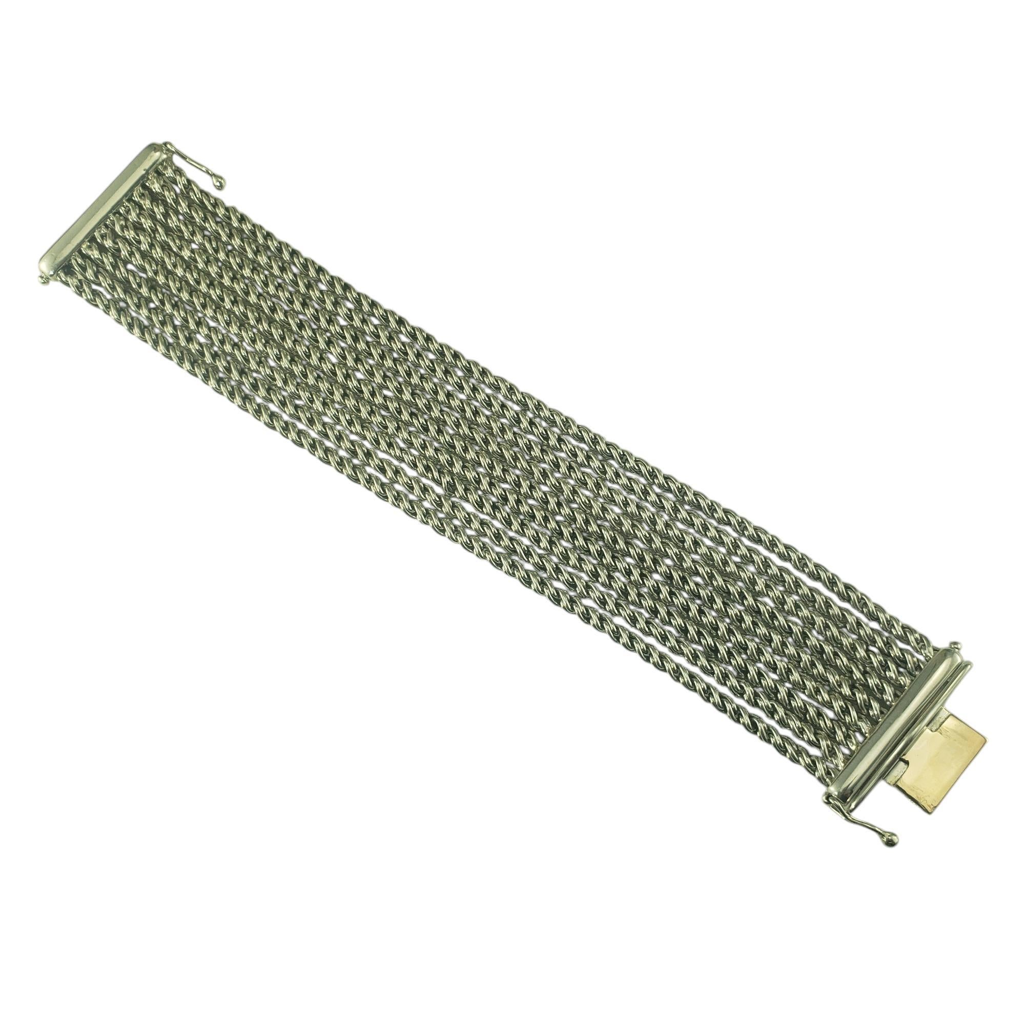 Tiffany & Co. Sterling Silver Nine Strand Rope Bracelet-

This gorgeous Tiffany & Co. sterling silver bracelet is crafted from nine textured flexible cables linked together by a double safety clasp.

Width: 1.25 inches.

Size: 7.25 inches

Weight: