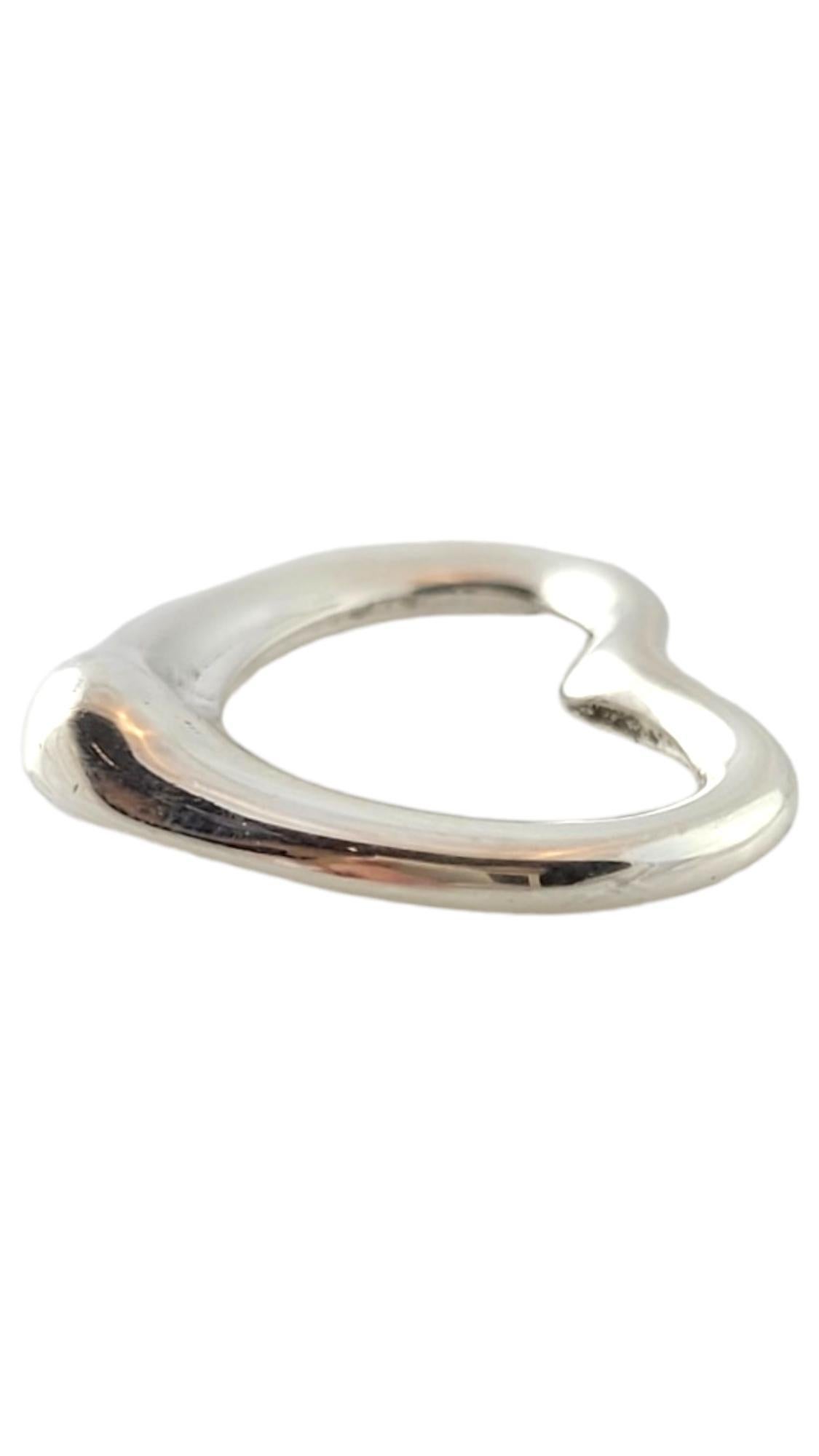 Tiffany & Co. Sterling Silver Open Heart Pendant 20mm

This gorgeous open-heart pendant by Tiffany & Co. is crafted from sterling silver and will look stunning on anyone!

Size: 19.6mm X 22.7mm X 3.8mm

Weight: 2.4 dwt/ 3.7 g

Hallmark: Tiffany & Co