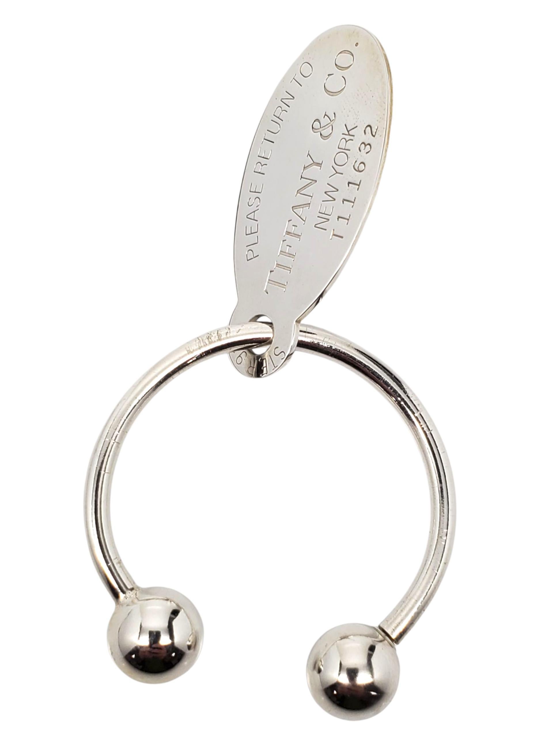 Tiffany & Co. Portachiavi con etichetta ovale in argento 925 - A. Silver

Questo classico portachiavi di Tiffany & Co. 