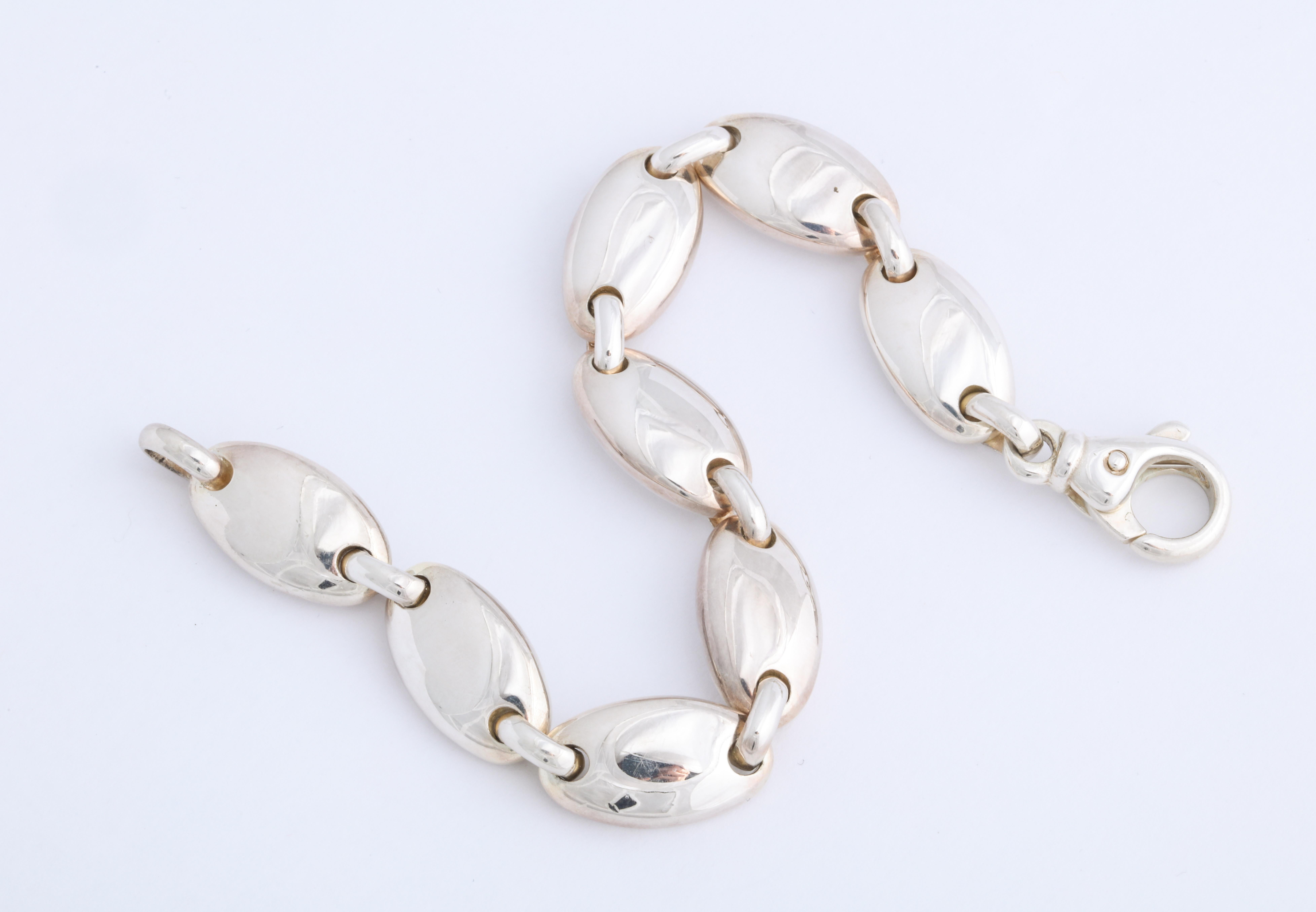 The solid sterling silver Pebble bracelet by Tiffany & Co.  (Discontinued) Measures 7 1/4 inches in length.  The design, quality and precision manufacturing Tiffany and Co. is famous for, is all here!  A great gift idea! Delivered with original