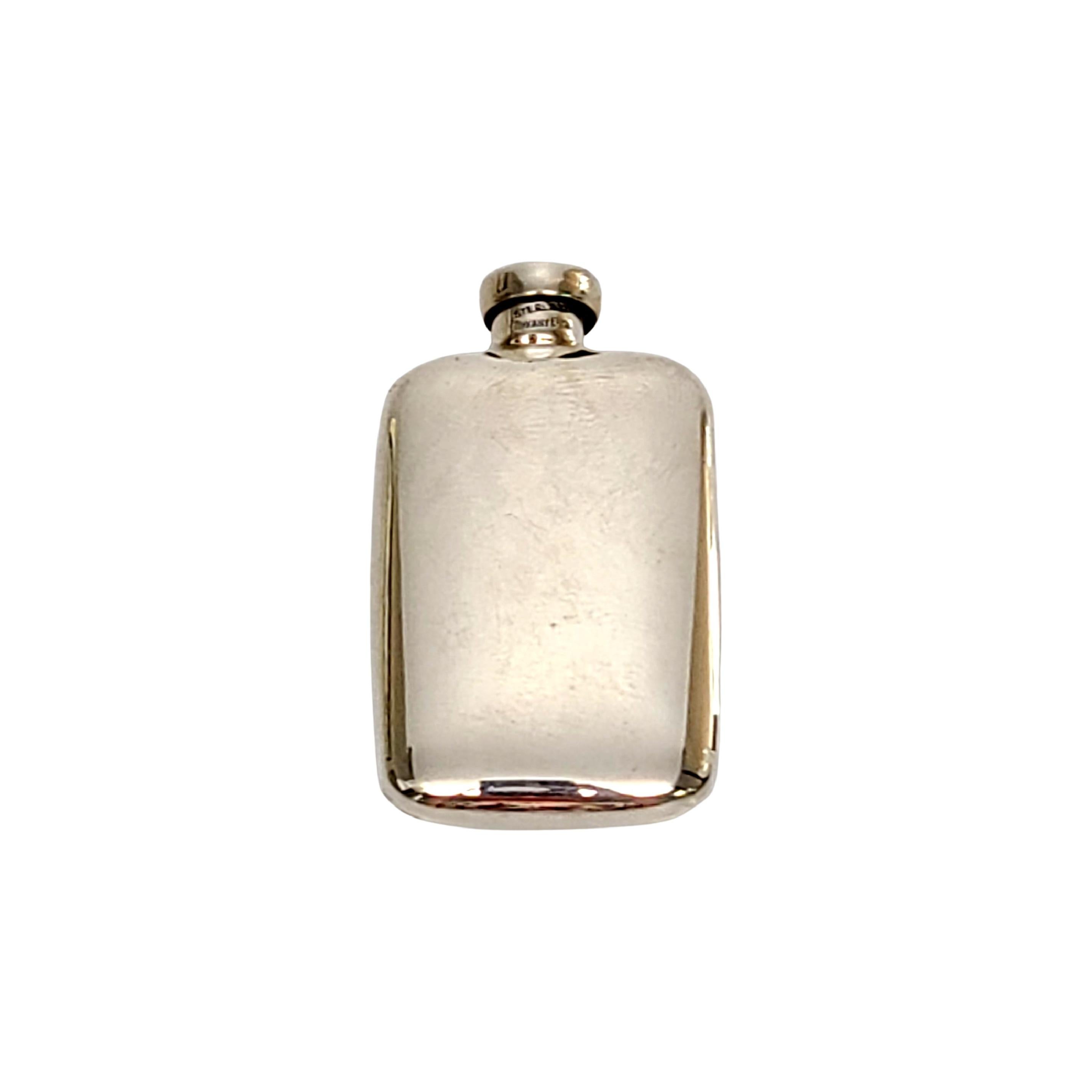 Sterling silver perfume bottle by Tiffany & Co.

This beautiful scent bottle features a smooth polished design on both sides and a screw-off top with dauber attached. Tiffany box and pouch not included.

Measures 1 3/4