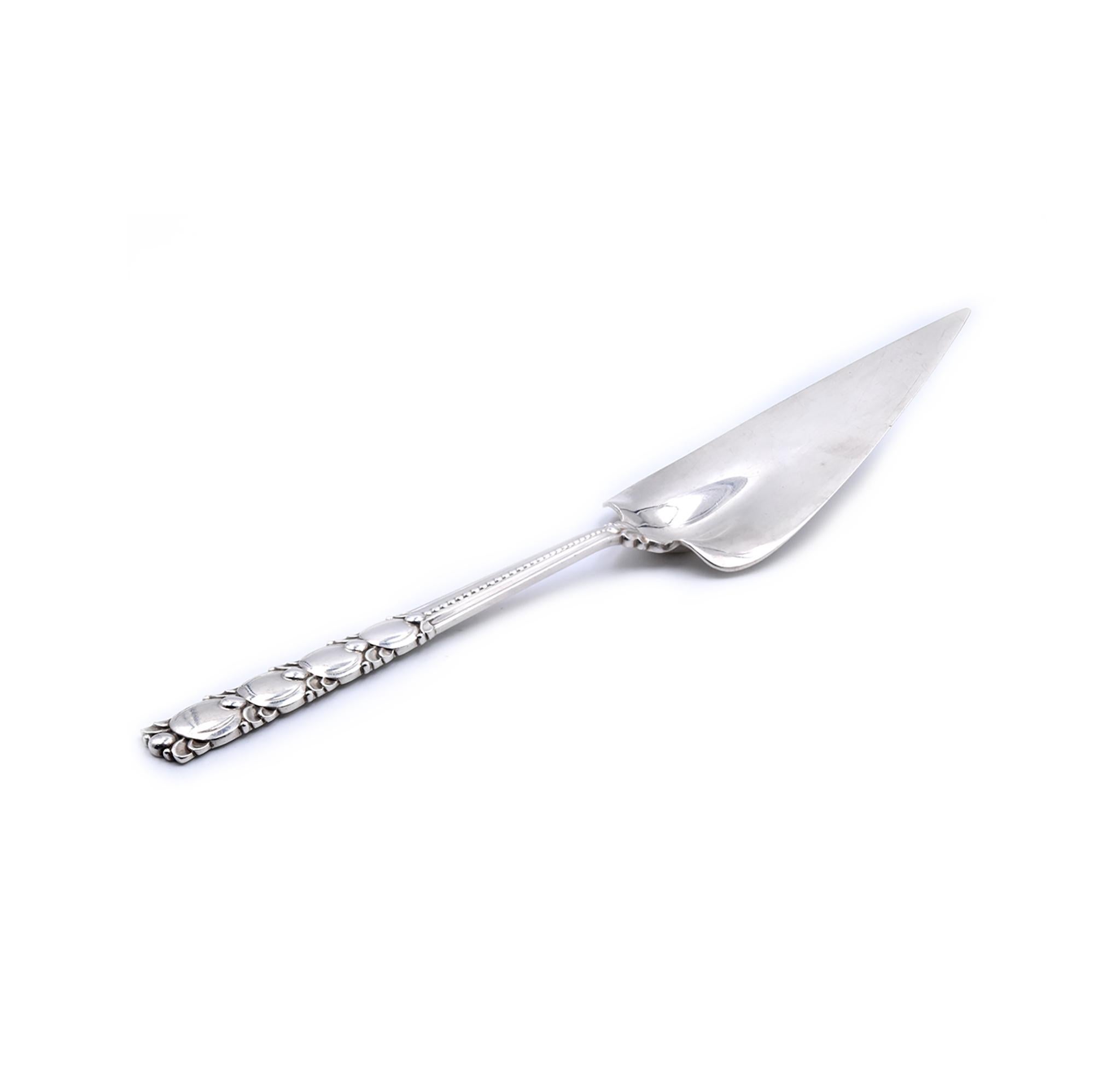 Designer: Tiffany & Co. 
Material: sterling silver
Dimensions: server measures 12 ¼” X 2 ¼“  
Weight: 167.85 grams
