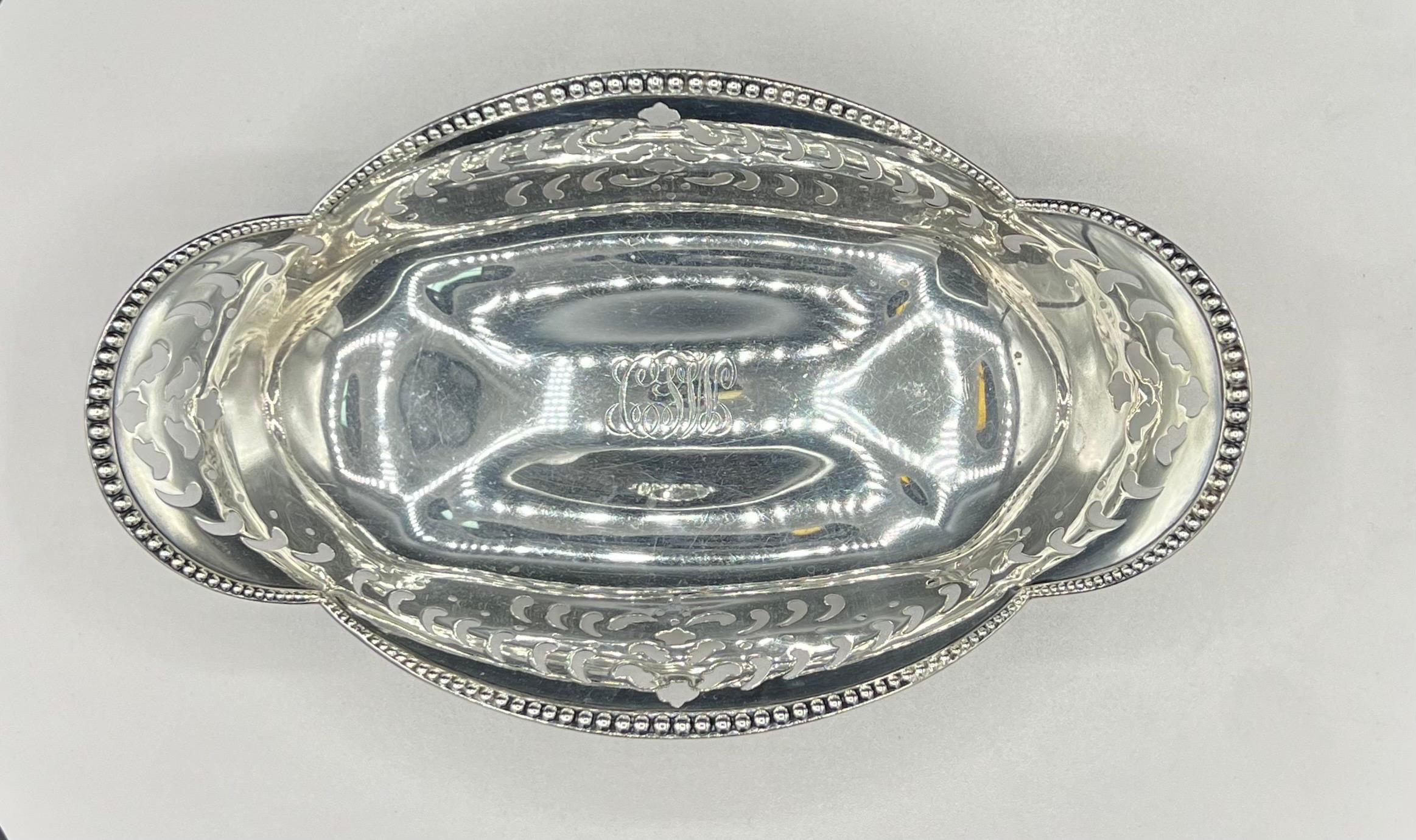 Tiffany & Co., sterling silver pierced condiment dish in pattern number 13835 from 1898. They measure 7 3/4'' in length by 4 7/8'' in width by 2'' in height and bear hallmarks as shown. Total weight is 7.6 troy ounces. 

The legendary Tiffany brand
