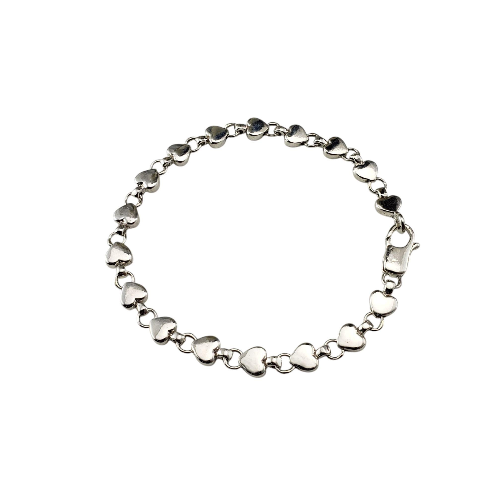 Tiffany & Co. Sterling Silver Puff Heart Link Bracelet-

Showcasing puffed heart charms along a sterling silver chain, this bracelet embodies timeless romance.

Width: 6 mm.

Size: Fits up to 7