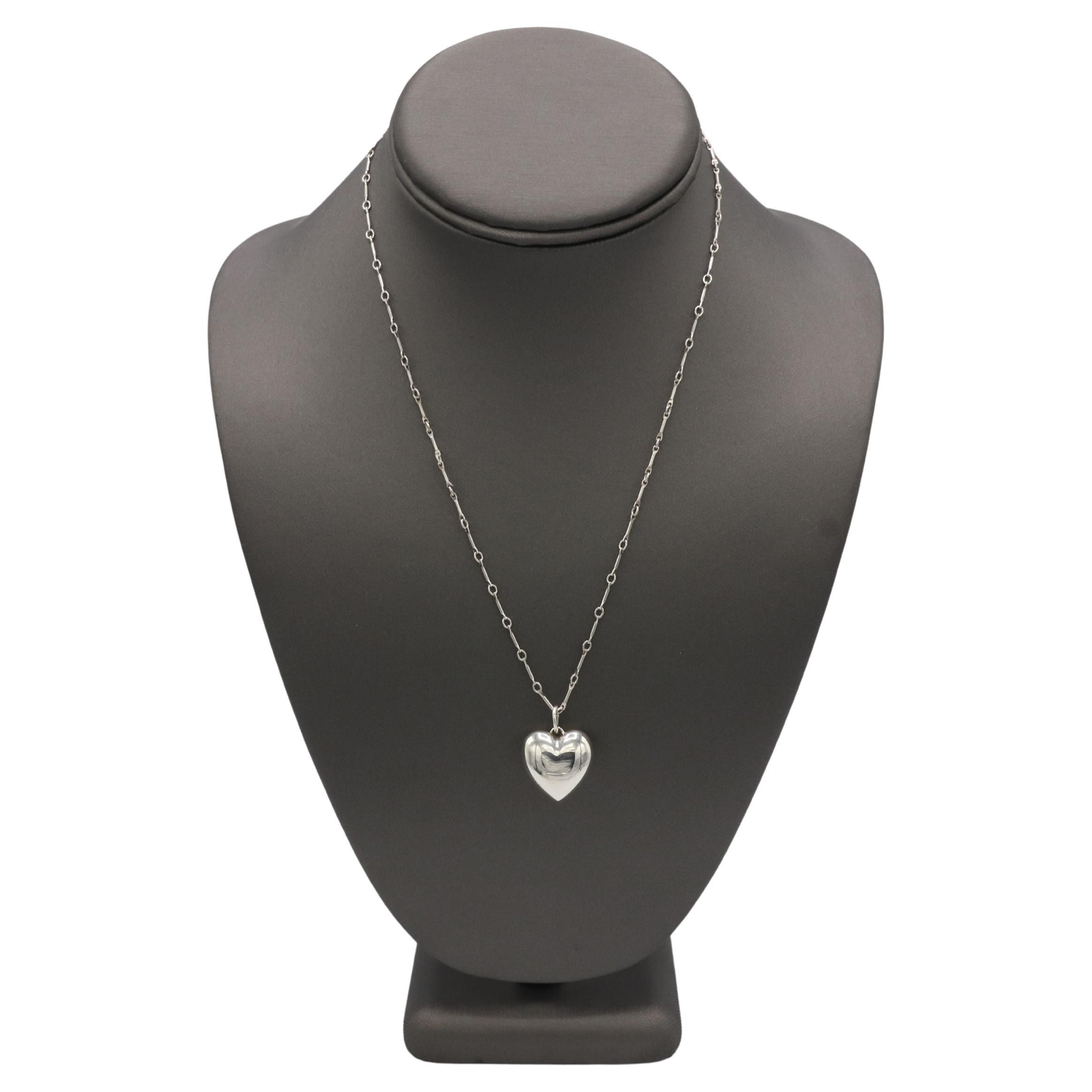 Tiffany & Co. Sterling Silver Puffed Heart Pendant Chain Link Necklace 
Metal: Sterling silver 925
Weight: 6.5 grams
Heart: 18.5 x 19mm
Chain: 18 inches
Signed: ©Tiffany & Co. Ag925 ITALY 