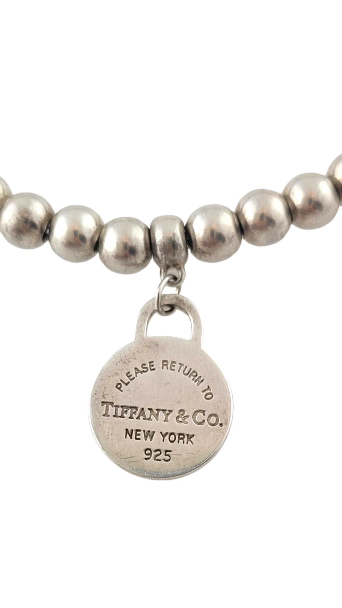 Vintage Sterling Silber Rückkehr zu Tiffany Herz Tag Bead Armband

Dieses wunderschöne Perlenarmband aus Sterlingsilber des Designers Tiffany & Co. ist mit einem Herzanhänger 
