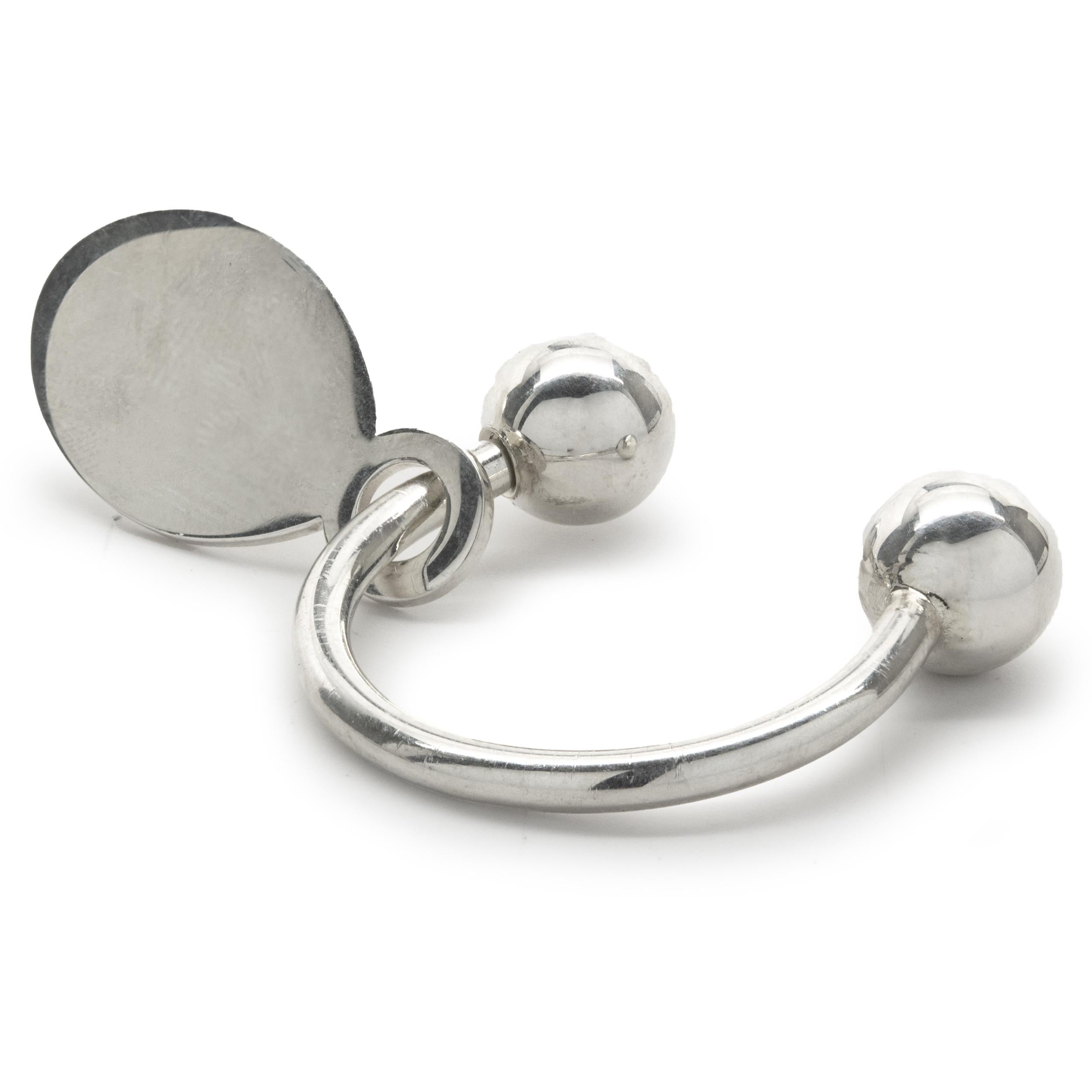 Designer: Tiffany & Co.
Material: Sterling Silver
Dimensions: key ring measures 55 x 30mm
Weight: 21.46 grams