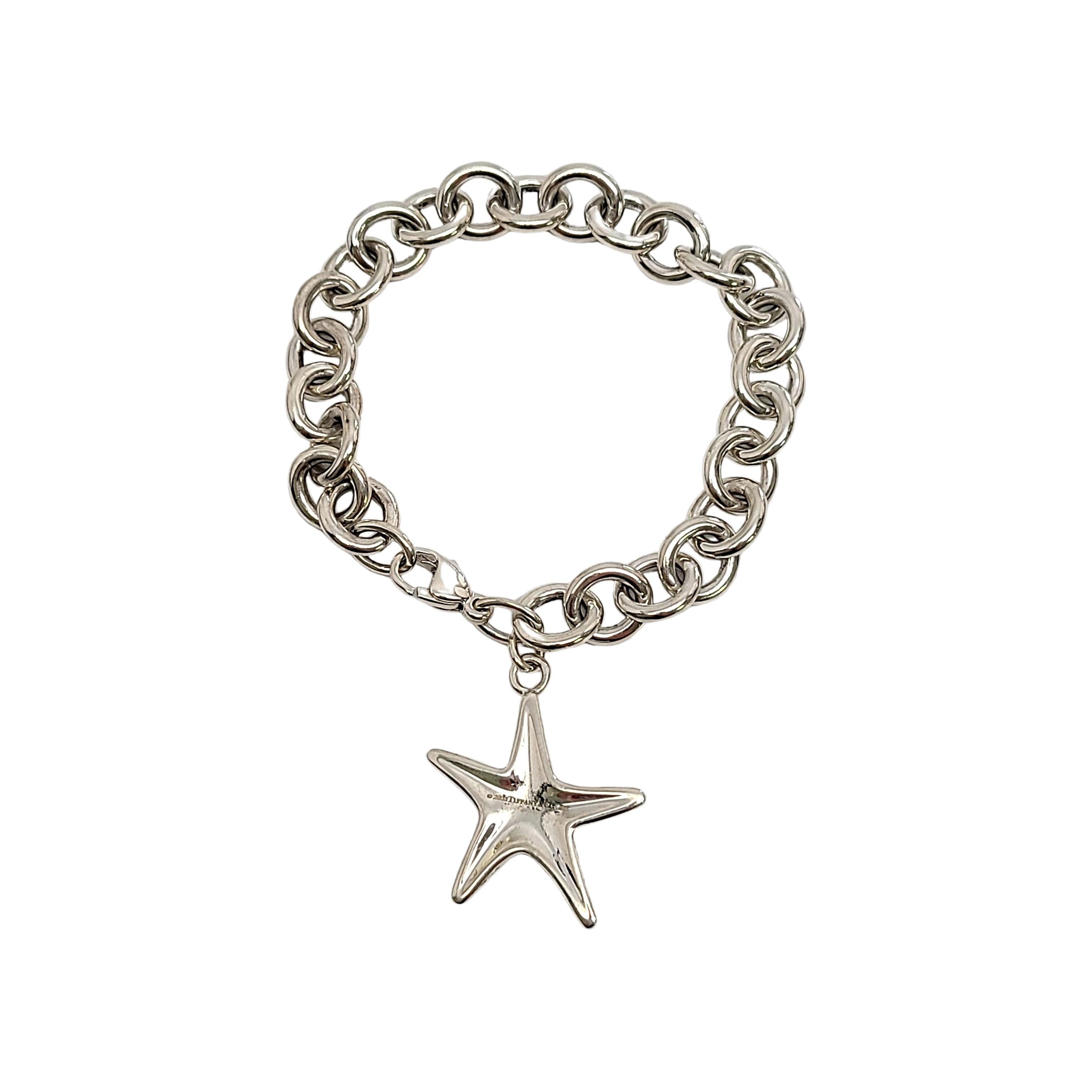Sterling silver rolo link bracelet with starfish dangle by Tiffany & Co.

Authentic Tiffany rolo link bracelet with a danging starfish featuring a small turquoise bead at its center. Lobster claw closure. Tiffany box and pouch not