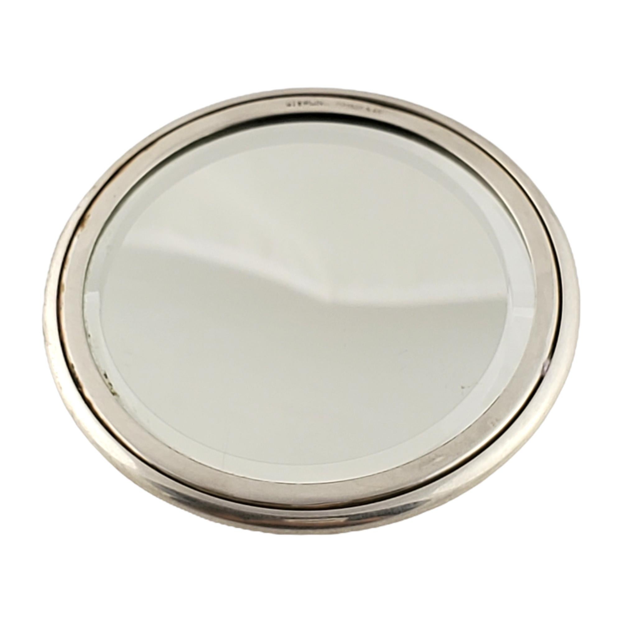 Tiffany & Co Sterling Silver Round Purse Mirror with Monogram.

Monogram appears to be SKD

Authentic Tiffany small round mirror with smooth polished finish. Tiffany pouch and box not included.

Measures approx 2 3/4