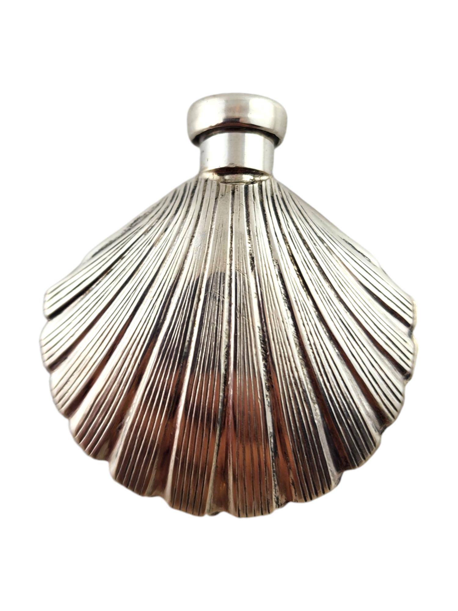 Tiffany & Co Sterling Silver Scallop Shell Perfume Bottle Dabber

This stunning perfume bottle dabber by Tiffany & Co. was meticulously crafted from sterling silver in the shape of a scallop shell!

Size: 37.2mm X 33.95mm X 10.95mm

Weight: 14.28 g/