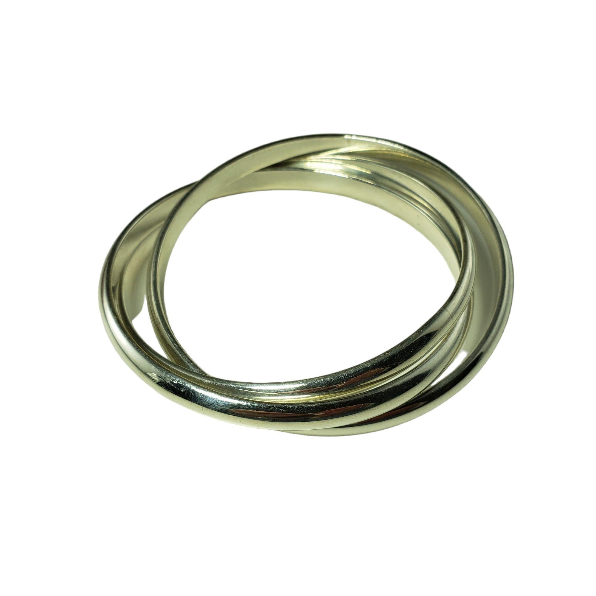Vintage Tiffany & Co. Sterling Silver Set of 3 Interlocking Bangle Bracelets-

These lovely interlocking bracelets by Tiffany & Co. are crafted in meticulously detailed sterling silver. Width of each bracelet: 6 mm.

Size: 8 inches

Weight: 95.8