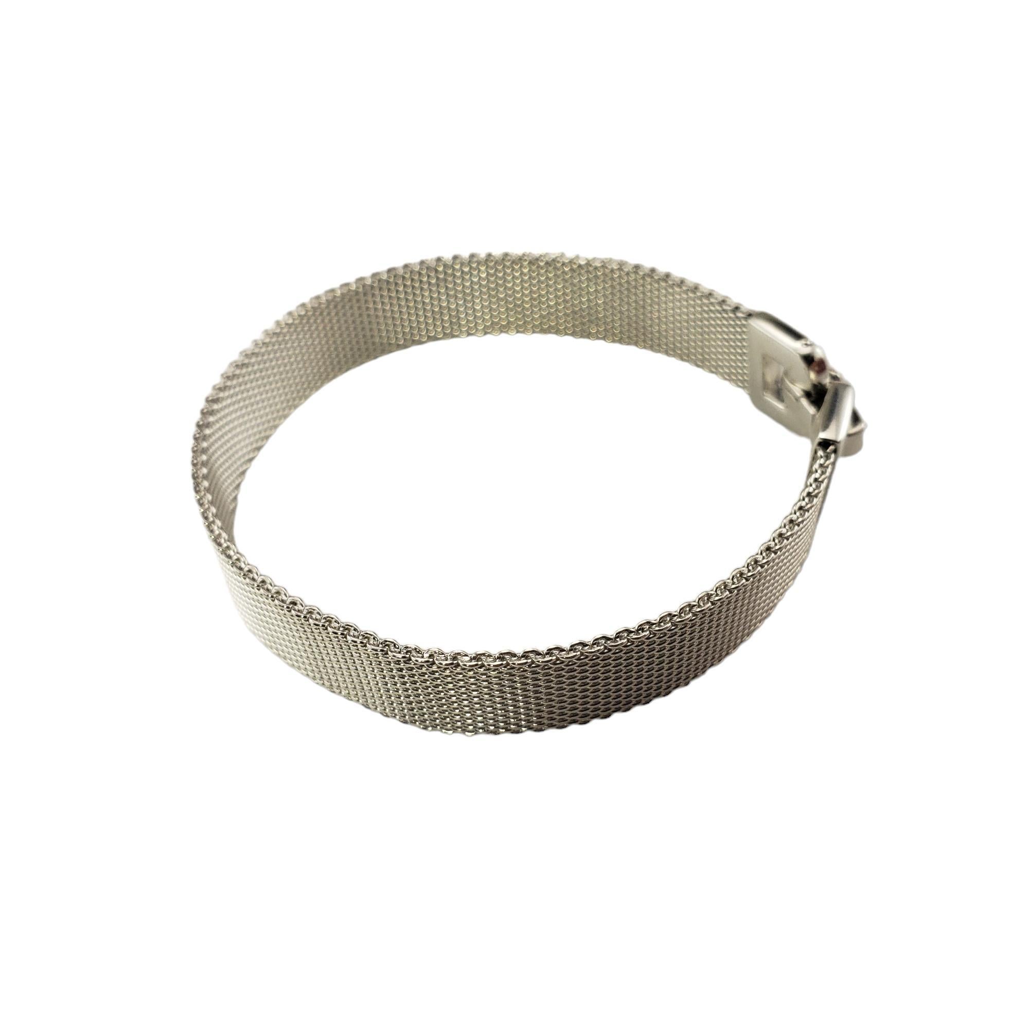 Vintage Tiffany & Co. Sterling Silver Somerset Mesh Bracelet-

This elegant mesh bracelet by Tiffany & Co. is crafted in meticulously detailed sterling silver.  Width: 9 mm.

Size: 6.5 inches

Hallmark:  T&CO.  925

Weight:  15.8 gr./  10.1