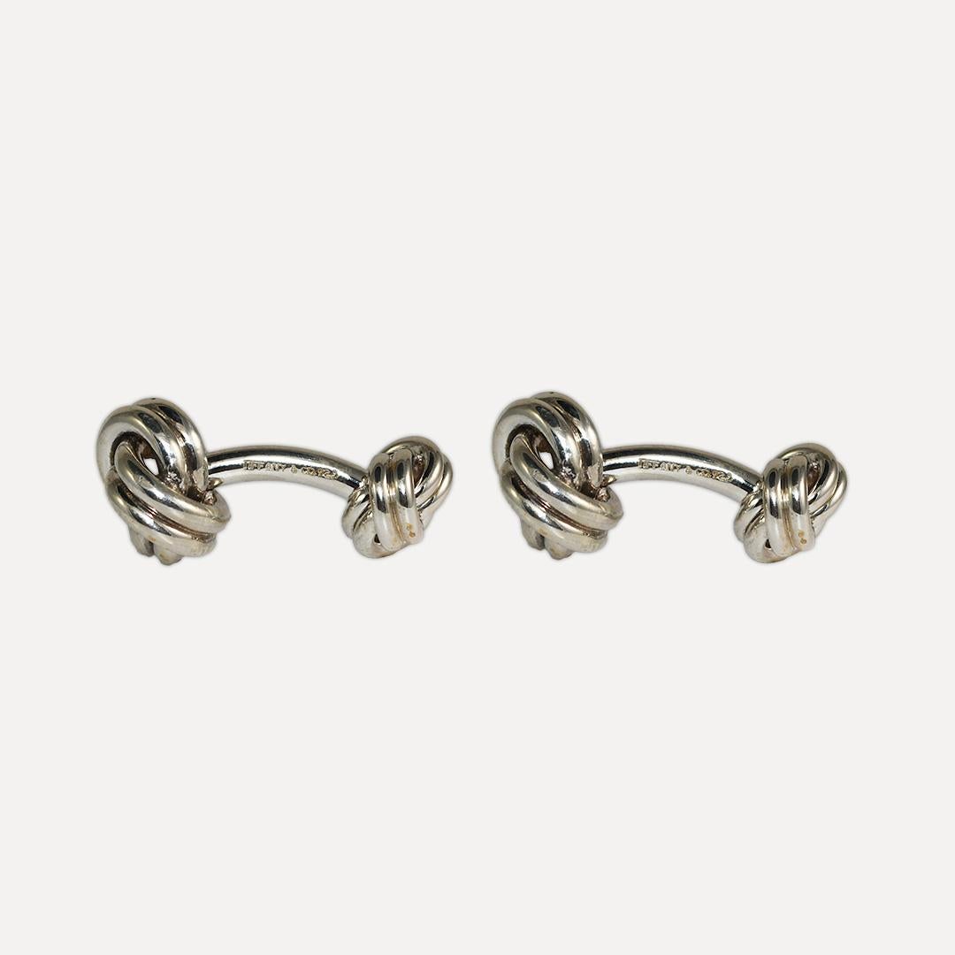 Tiffany & Co. sterling silver knot cufflinks.
Stamped Tiffany & Co 925 and weighs 16.8 grams.
They measure 1 inch by 3/8 inch.
Like new condition.
Comes with an original Tiffany turquoise bag.