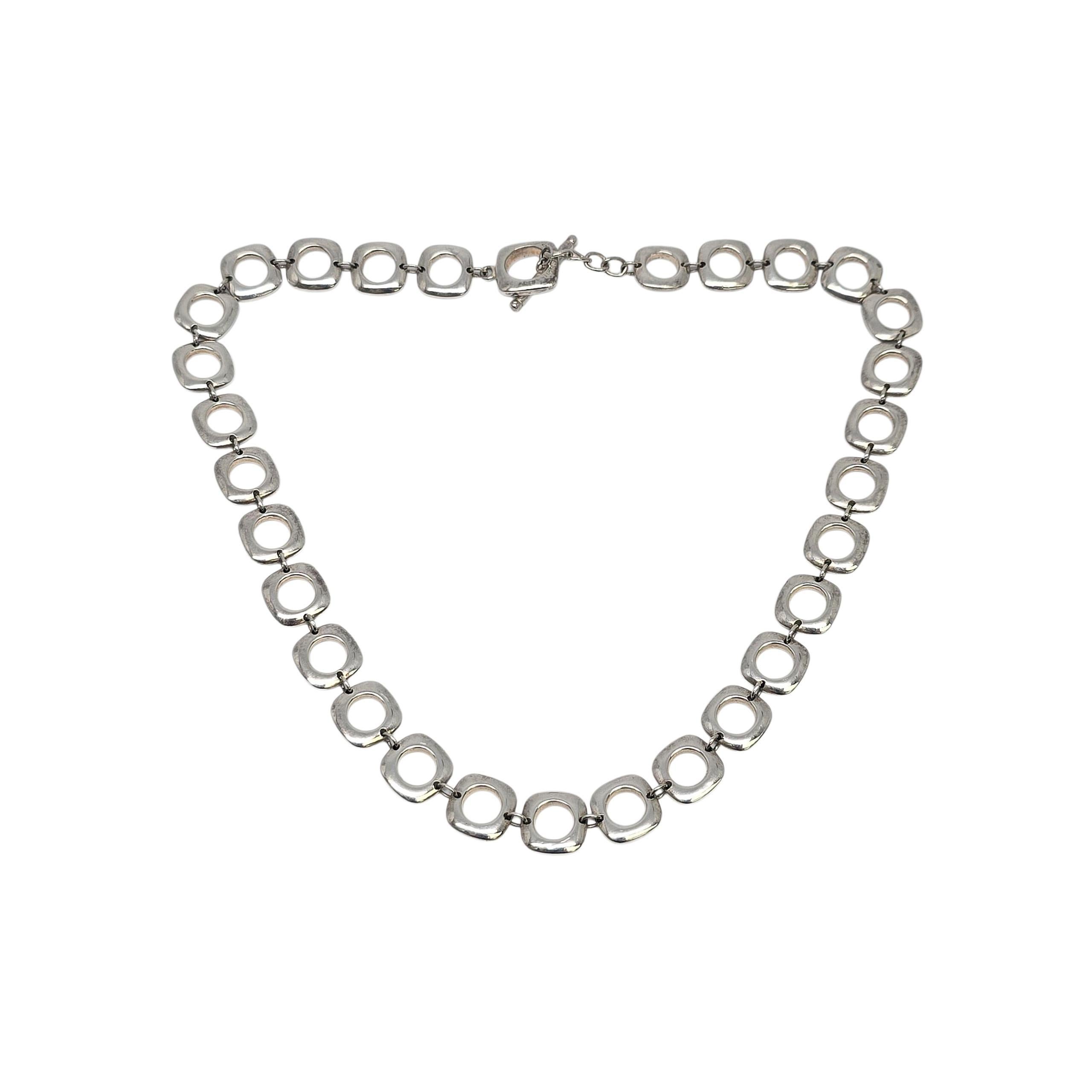 Sterling Silver Square Cushion Link Chain Toggle Necklace by Tiffany & Co

Beautiful authentic Tiffany & Co necklace featuring sterling silver square cushion links with round hole centers. Toggle closure. Tiffany & Co box and pouch are not