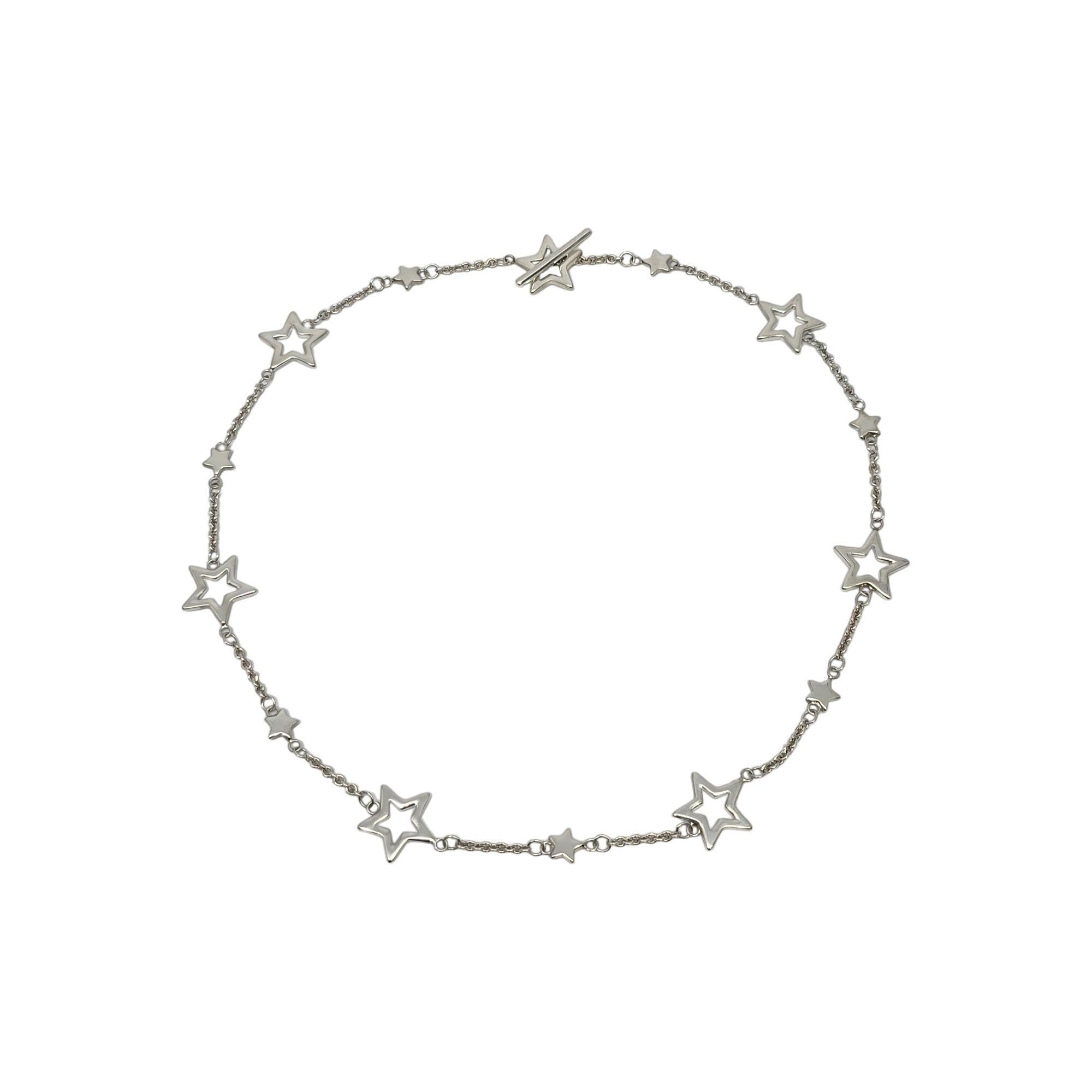 Tiffany & Co sterling silver star chain toggle necklace.

This authentic Tiffany necklace features larger open stars and smaller solid stars on a chain. Toggle closure. Tiffany pouch and box are not included.

Measures approx 16 1/2