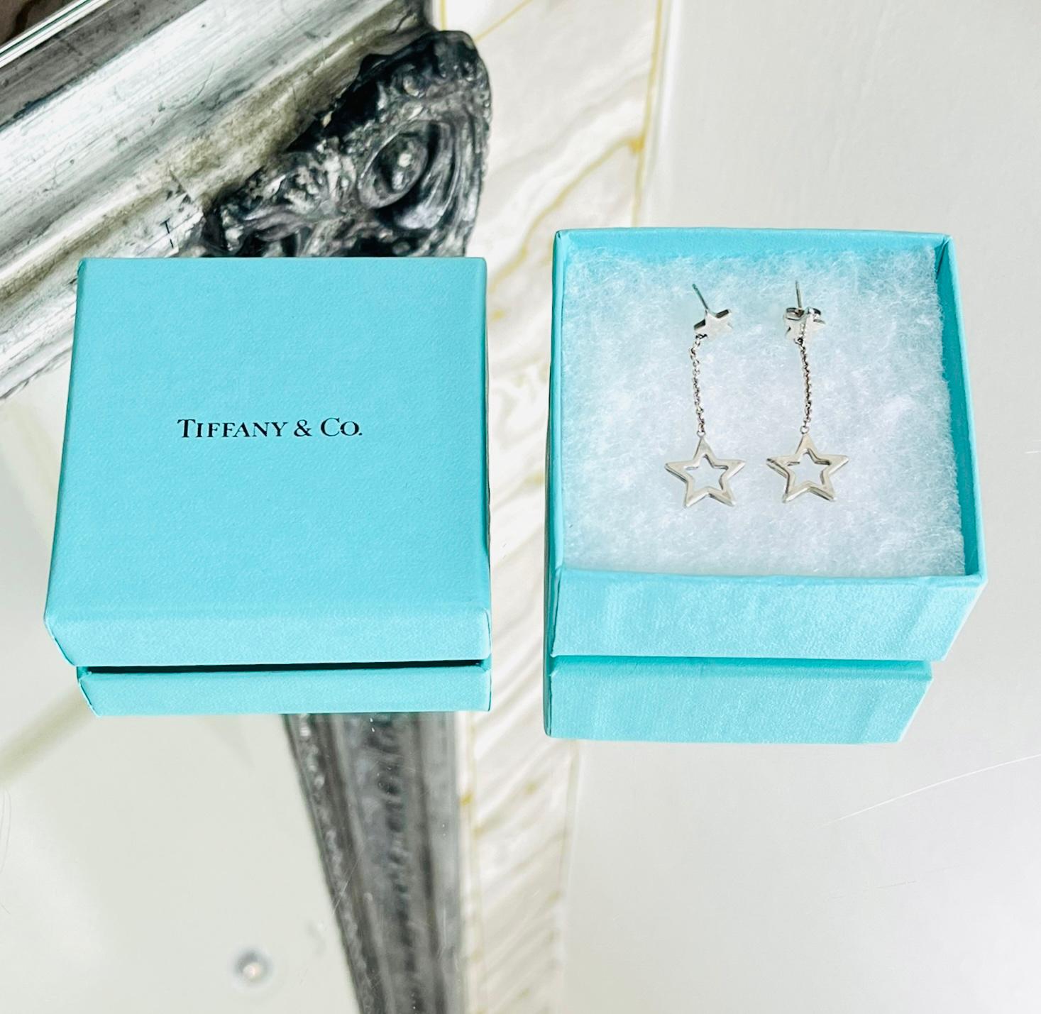 Tiffany & Co. Sterling Silver Star Drop Earrings

Silver dangle earrings designed with tiny stars and chain link drop with star hoops.

Featuring butterfly back closure.

Size – One Size

Condition – Good (One butterfly back missing, light