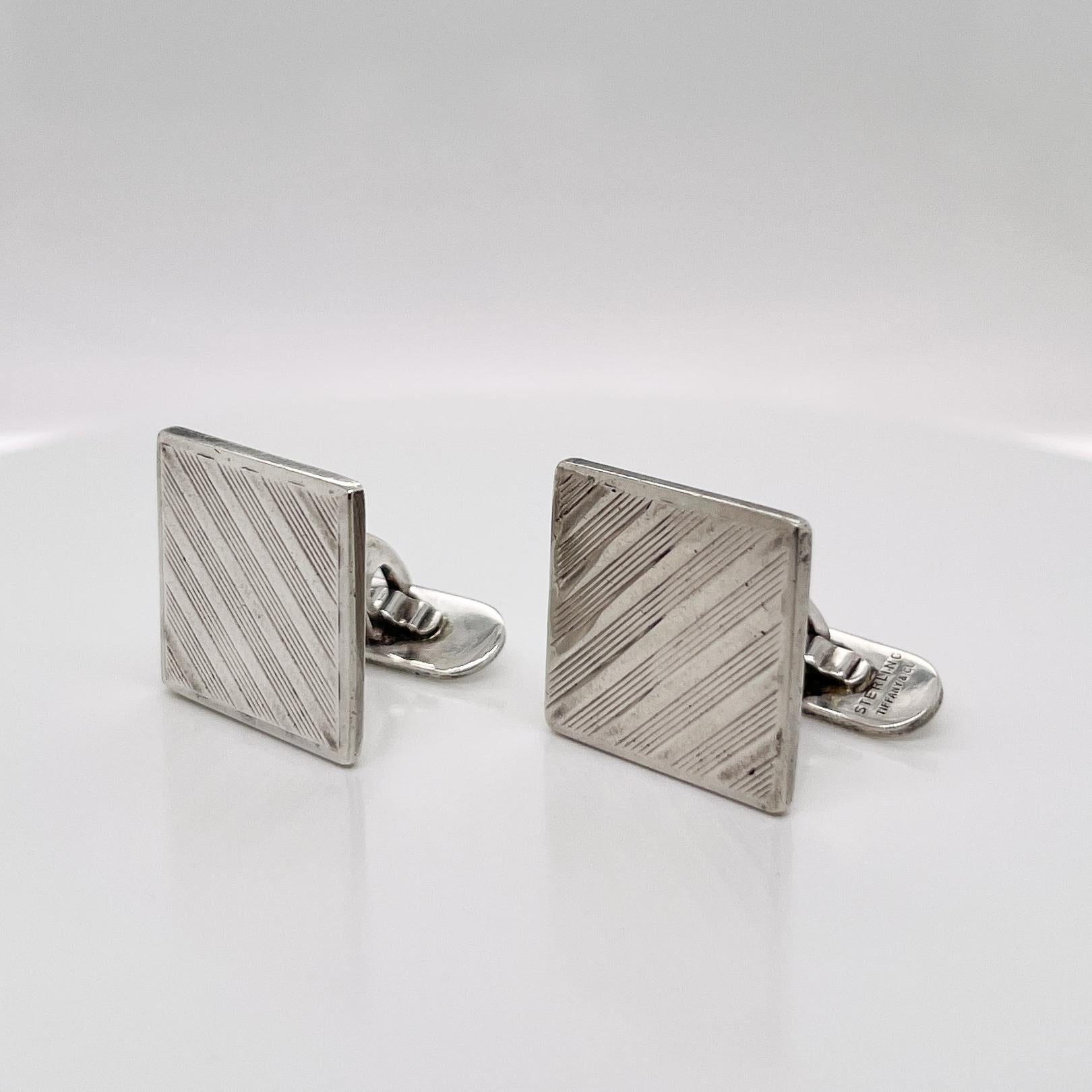 A very fine pair of Tiffany & Co. sterling silver cufflinks.

Having sterling silver square heads engraved with alternating thick and thin diagonal stripes.

Simply a smart pair of Tiffany links!

Date:
20th Century

Overall Condition:
It is in
