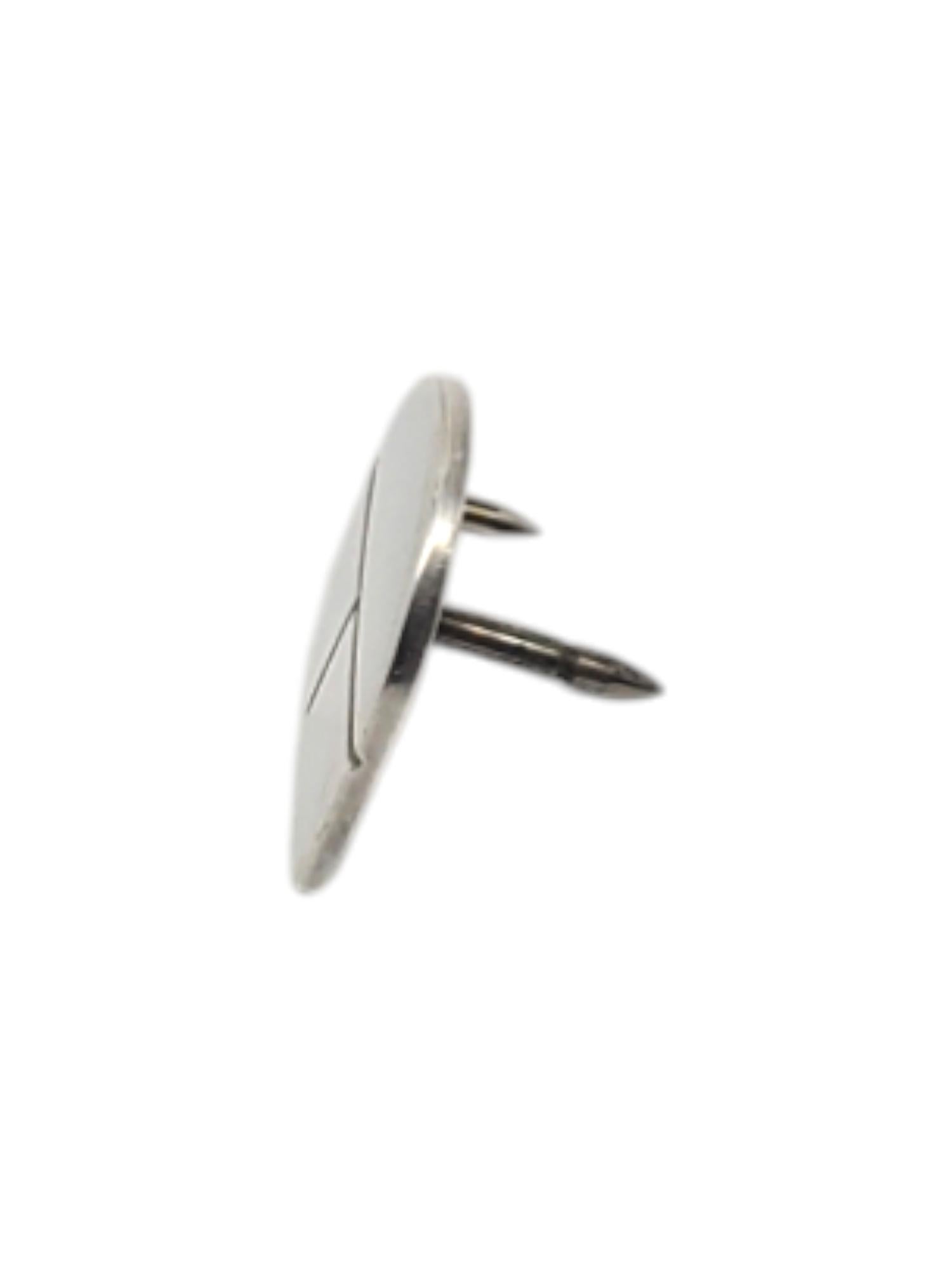 Tiffany & Co. Sterling Silver tie tac/Lapel Pin -

This vintage tie tac/ lapel pin is set in classic sterling silver by Tiffany & C0.

Size: 11.30 mm x 10.94 mm

Stamped: T. & CO. 925

Clutch is not sterling silver

Weigh: 0.8 dwt / 1.24g

Very good