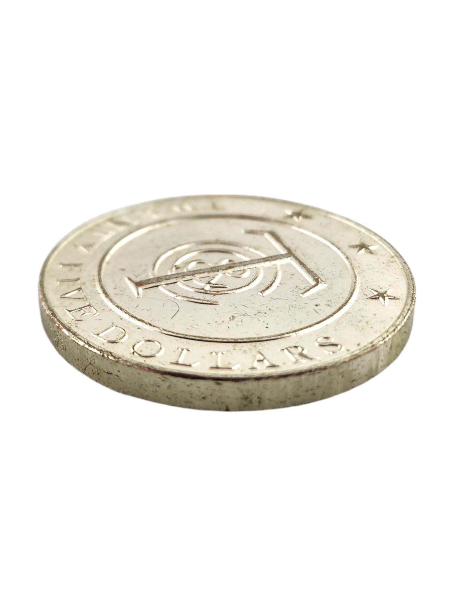 Tiffany & Co Sterling Silver Twenty-Five Dollars Coin

This twenty-five-dollar coin by designer Tiffany & Co was crafted from sterling silver with 