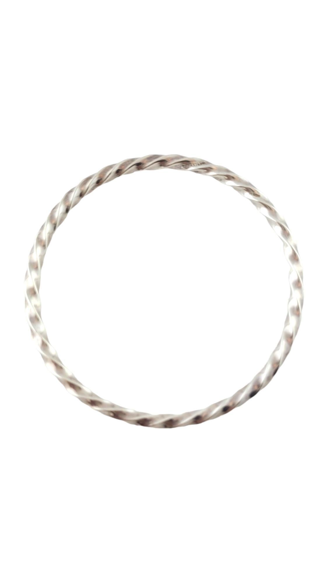 Tiffany & Co. Sterling Silver Twist Bangle Bracelet 

This gorgeous sterling silver twisted bangle bracelet was created by designer Tiffany & Co.!

Size: 7.75