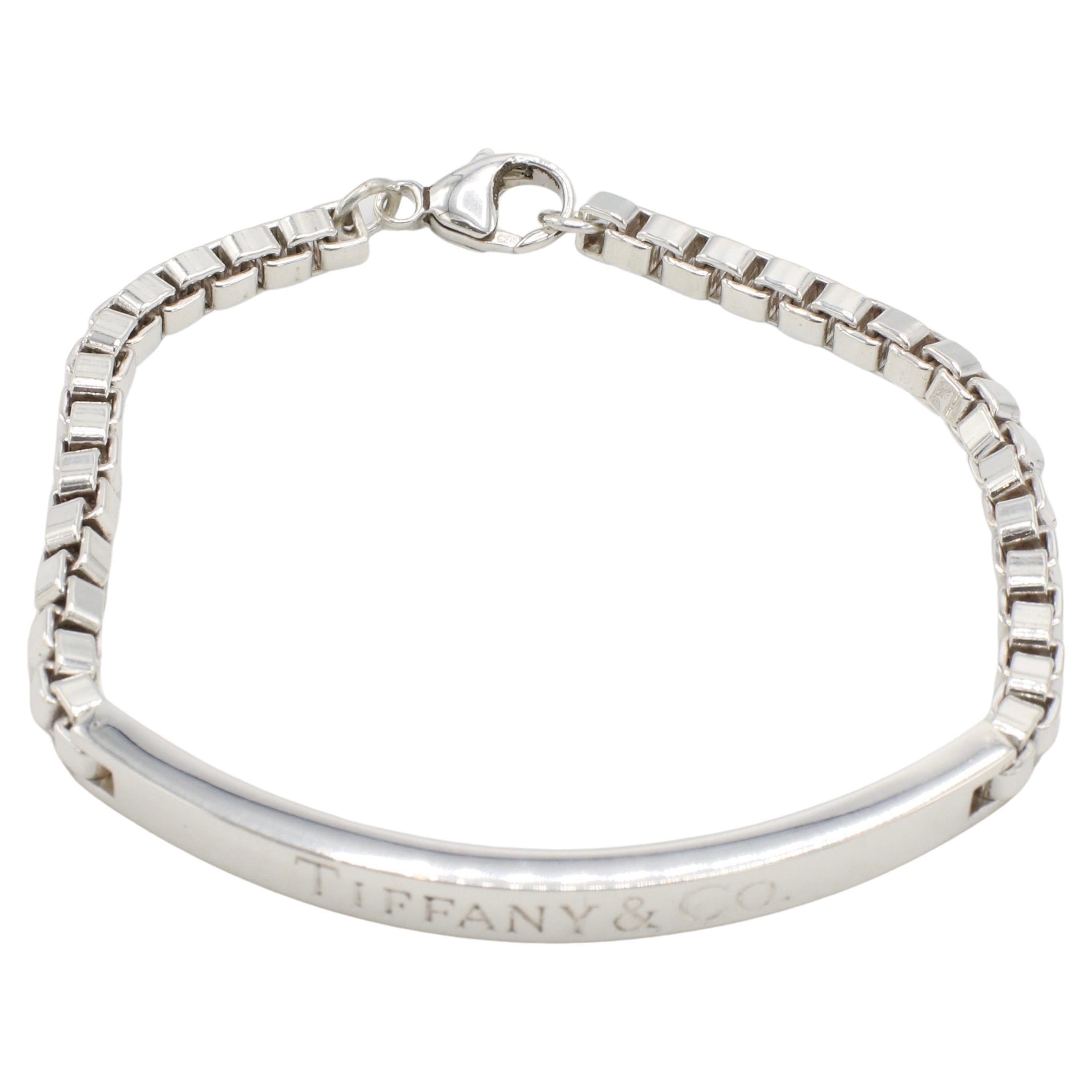 Tiffany & Co. Sterling Silver Venetian Box Link Chain ID Bar Bracelet 
Metal: Sterling silver
Weight: 19 grams
Length: 6.75 inches clasped 
Signed: Tiffany & Co. ©Tiffany & Co. AG925
