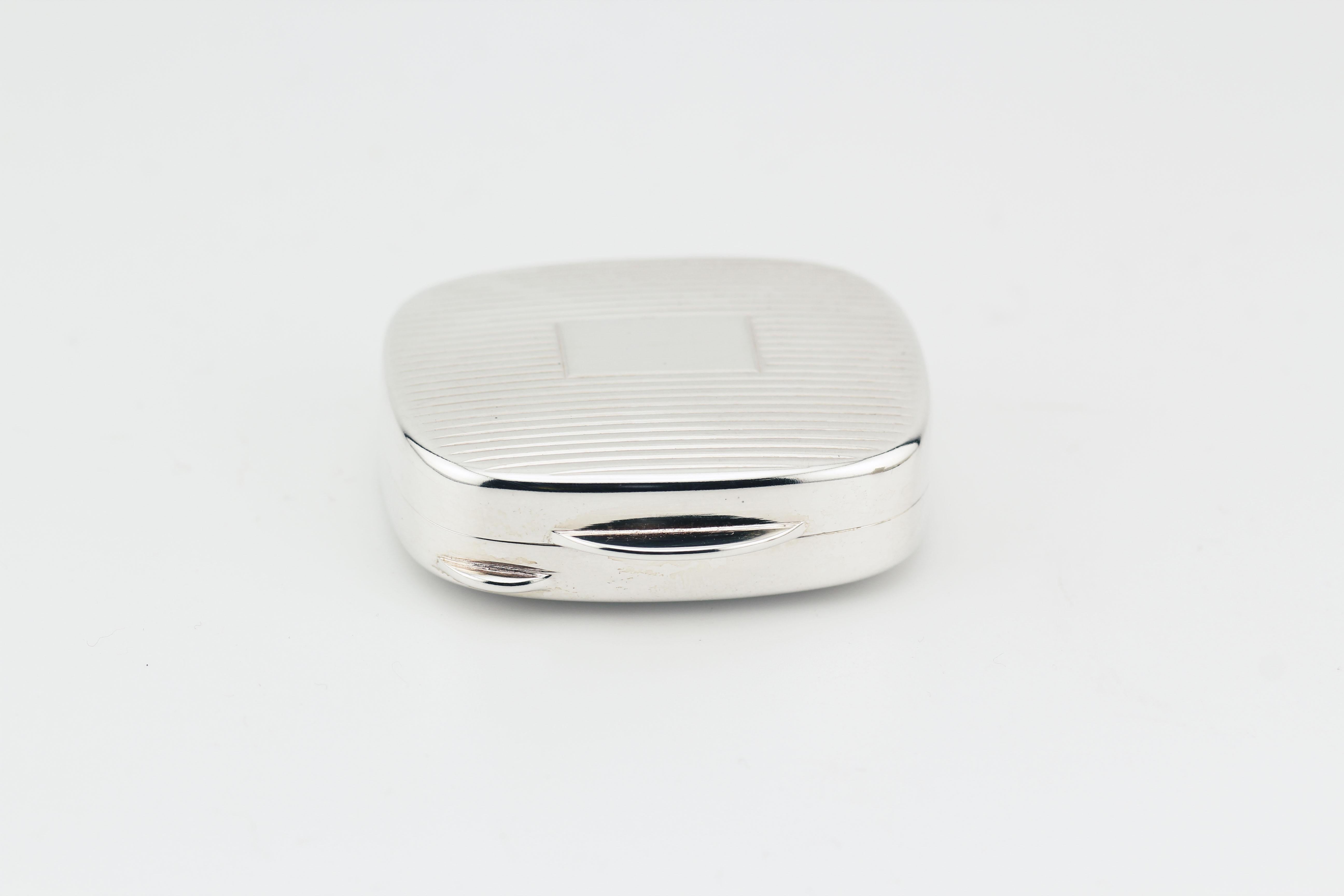 Introducing the Tiffany & Co. Sterling Silver Vintage Rectangular Pill Box with Striped Design – a timeless and exquisite accessory that embodies the heritage of Tiffany & Co.'s renowned craftsmanship. This vintage pill box is a testament to the