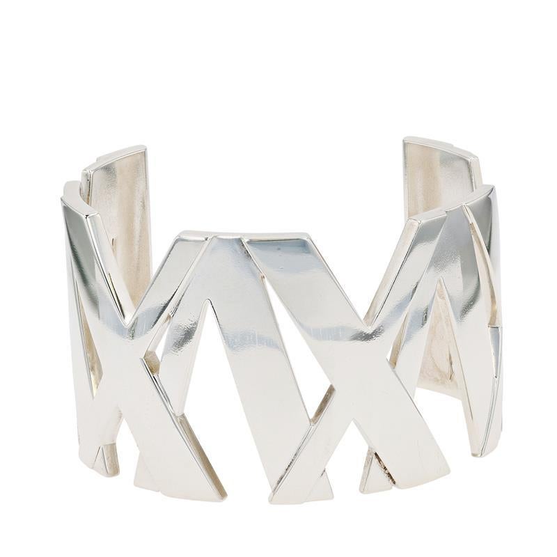 A vintage sterling silver Tiffany & Co. wide cuff bracelet from the Atlas collection.
The Tiffany & Co. Atlas collection draws inspiration from the famed Atlas clock which was originally mounted by Tiffany in 1853 before arriving at its current