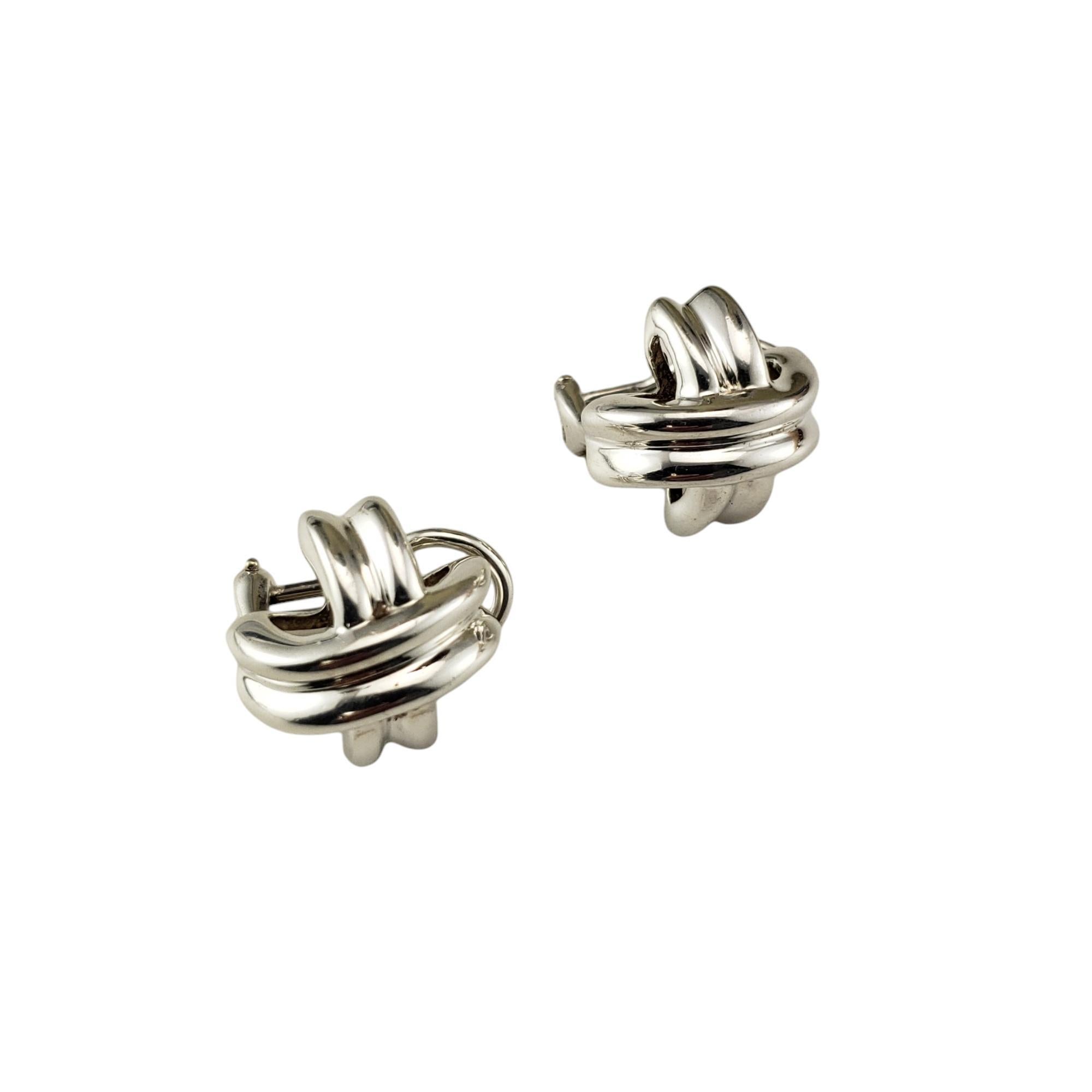 Vintage Tiffany & Co. Sterling Silver X Earrings

These elegant X earrings by Tiffany & Co. are crafted in beautifully detailed sterling silver.  

Omega back closures.

Size: 15 mm x 15 mm

Hallmark:  1990  T&CO  925

Weight: 5.5 dwt./ 8.6