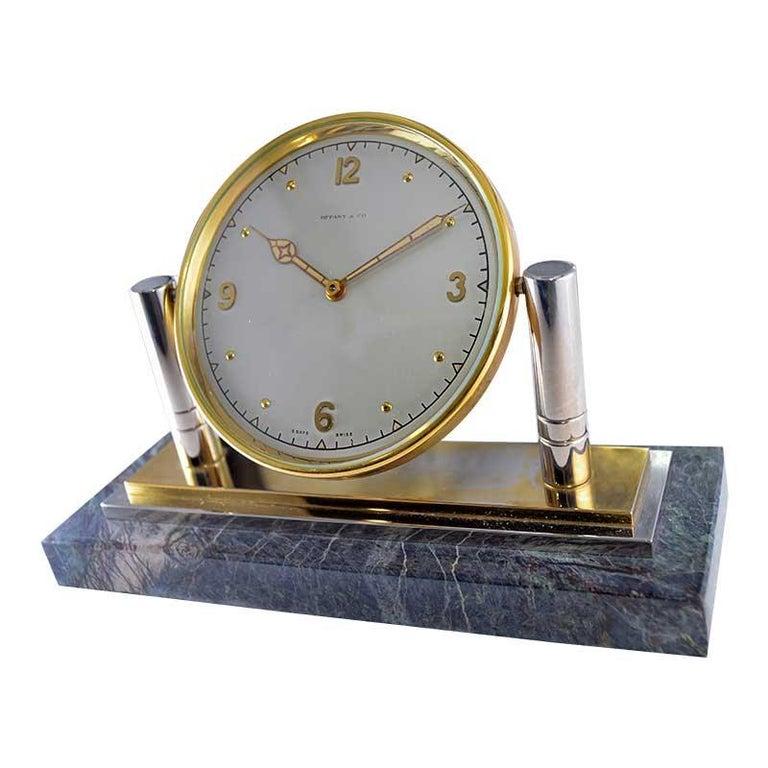 FACTORY / HOUSE: Tiffany & Co.
STYLE / REFERENCE: Art Deco / Articulated Desk Clock 
METAL / MATERIAL: Nickle, Brass, Stone
CIRCA / YEAR: 1930's
DIMENSIONS / SIZE: 12 Length X 17 Diameter
MOVEMENT / CALIBER: Manual Winding / 15 Jewels / 8