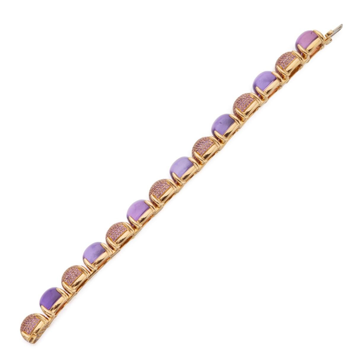 A magnificent authentic Tiffany & Co bracelet by Paloma Picasso composing of 7 amethyst cabochones and alternating pave amethyst sections set in 18k gold.

